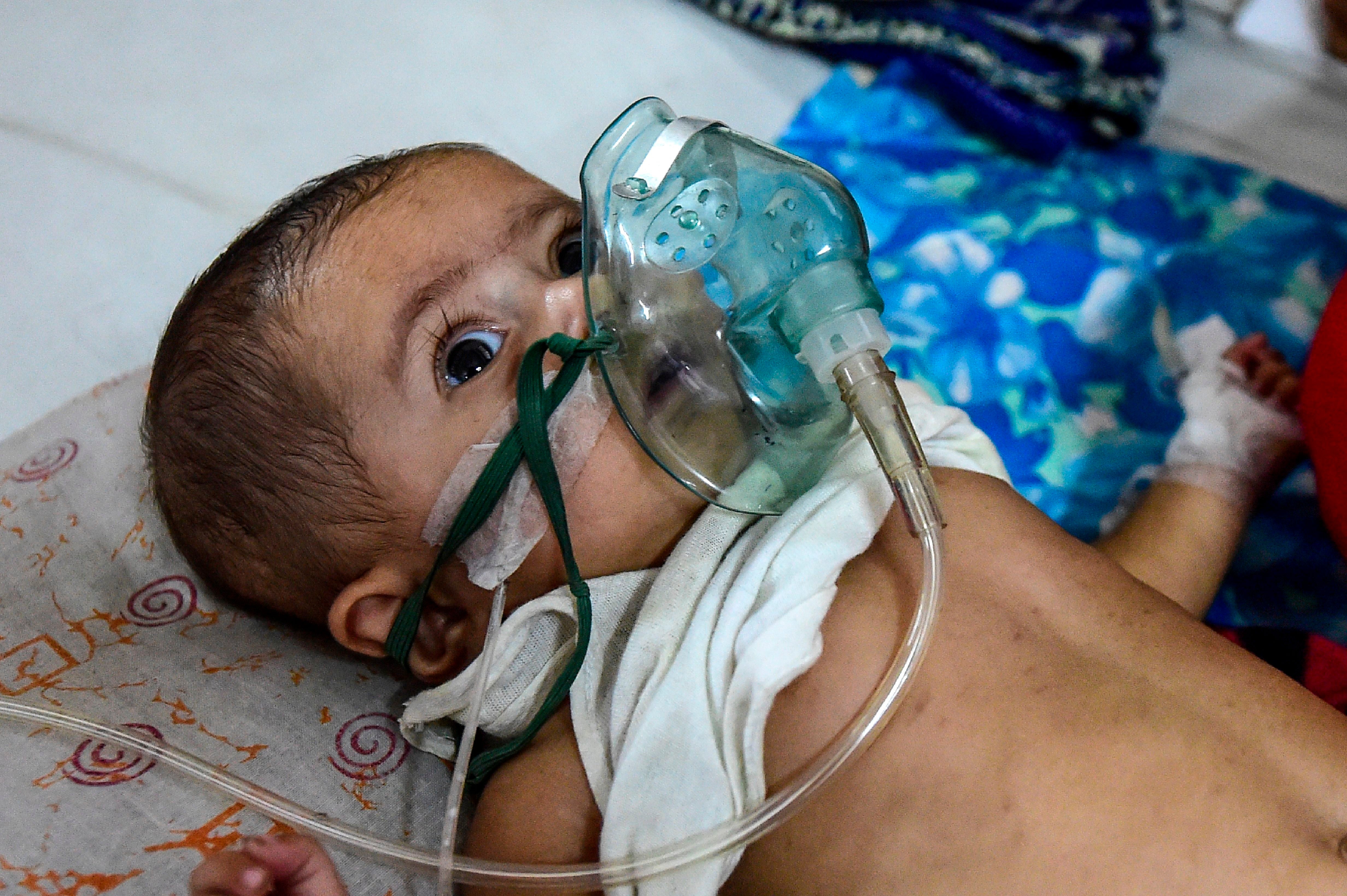 File image: A baby suffering from respiratory disease receives treatment in Dhaka