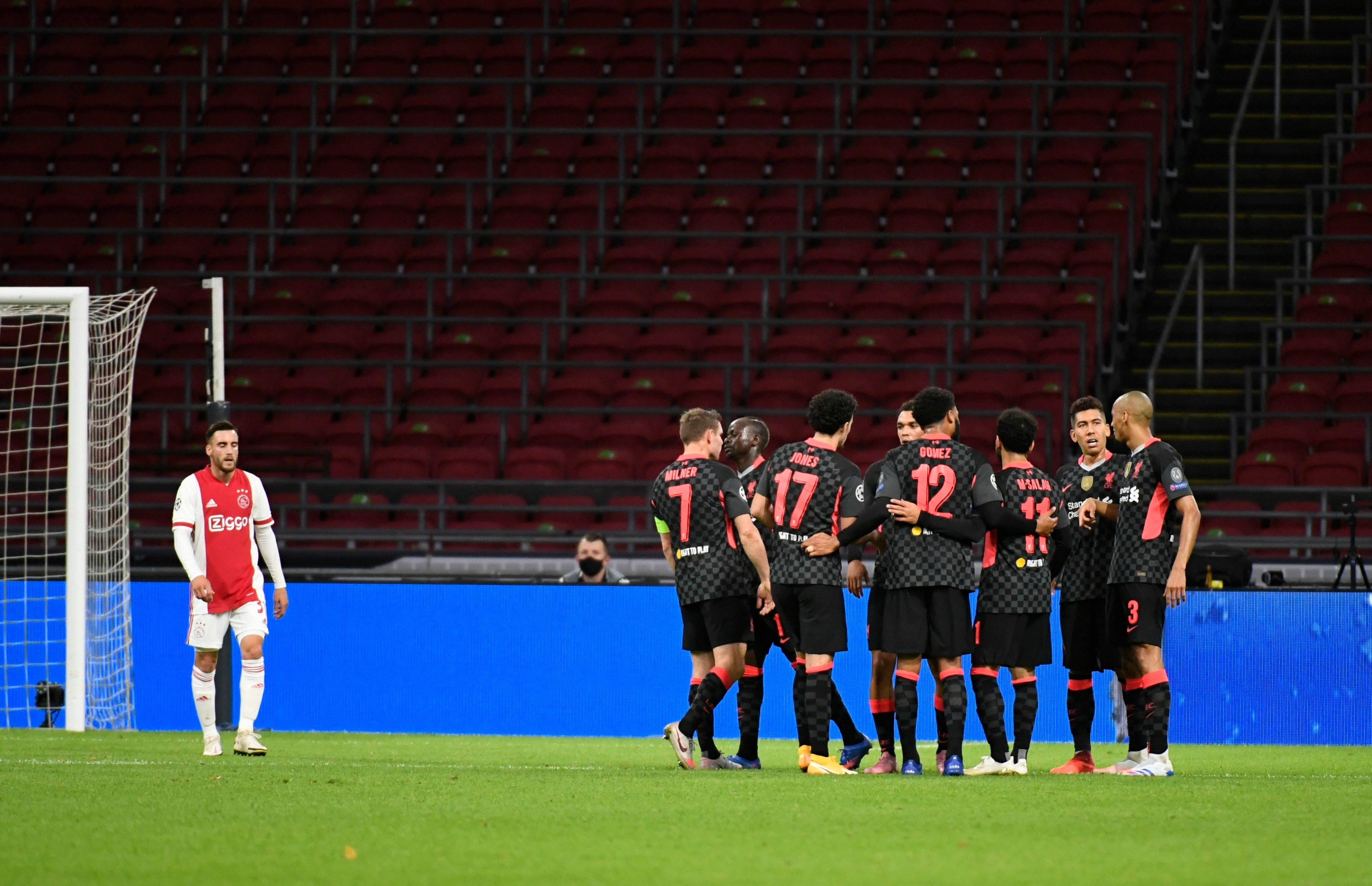 Liverpool celebrate after taking the lead in Amsterdam