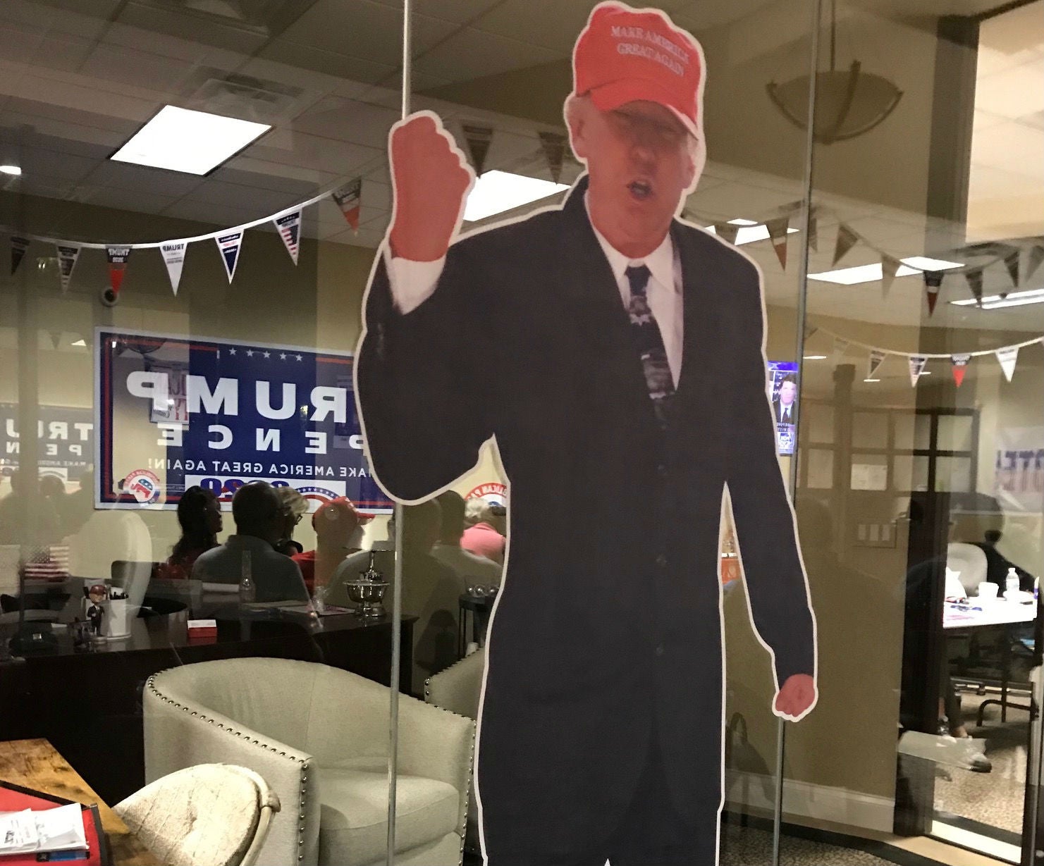 Two cuts outs of president watched over debate in Daytona Beach