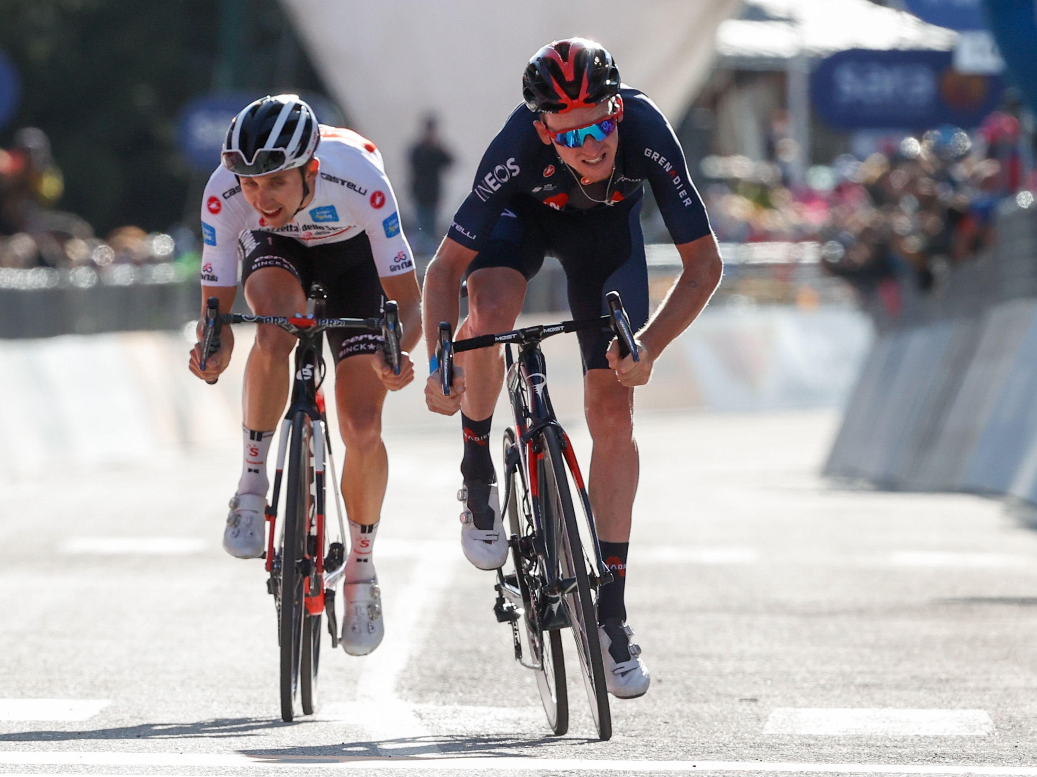 Tao Geoghegan Hart, right, sprints clear of Jai Hindley to win stage 20