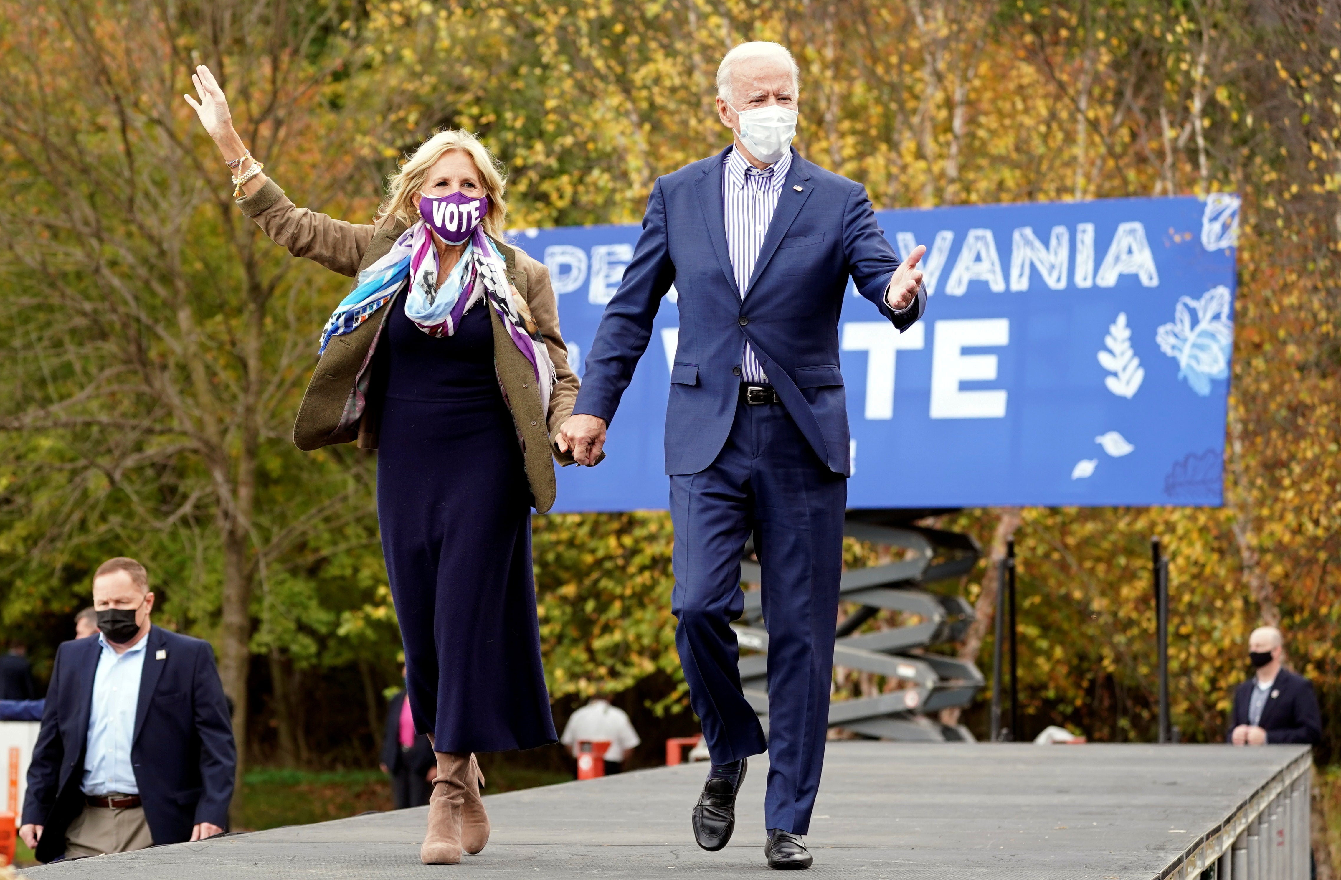 U.S. Democratic presidential candidate Joe Biden and his wife Jill Biden arrive for a drive-in campaign event at Bucks County Community College in Bristol, Pennsylvania, U.S., October 24, 2020. REUTERS/Kevin Lamarque     TPX IMAGES OF THE DAY