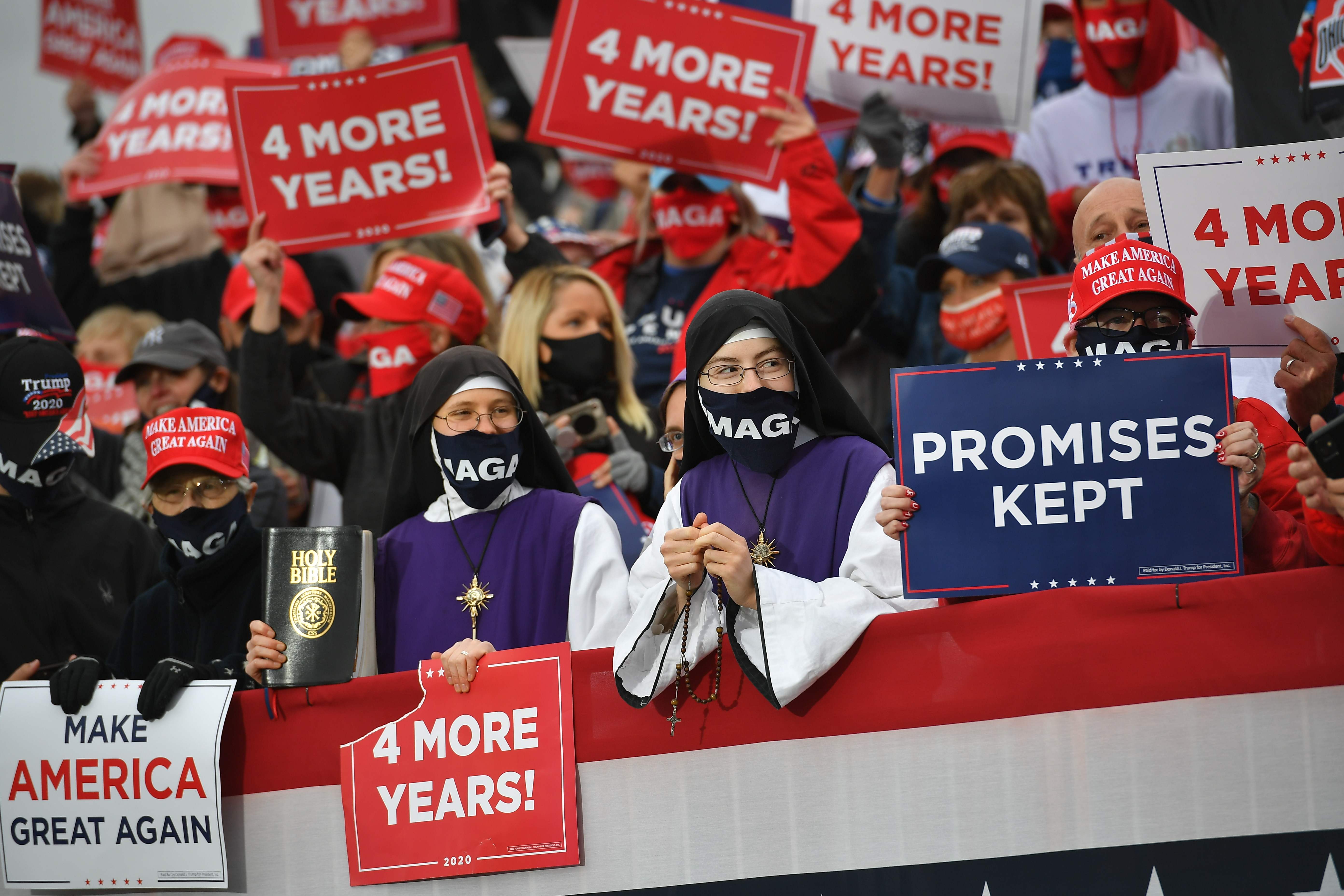 Supporters listen to US President Donald Trump speak during a campaign rally at Pickaway Agriculture and Event Center in Circleville, Ohio on October 24, 2020. (Photo by MANDEL NGAN / AFP) (Photo by MANDEL NGAN/AFP via Getty Images)