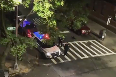 New York police officer uses patrol car loudspeaker to shout 'Trump 2020'