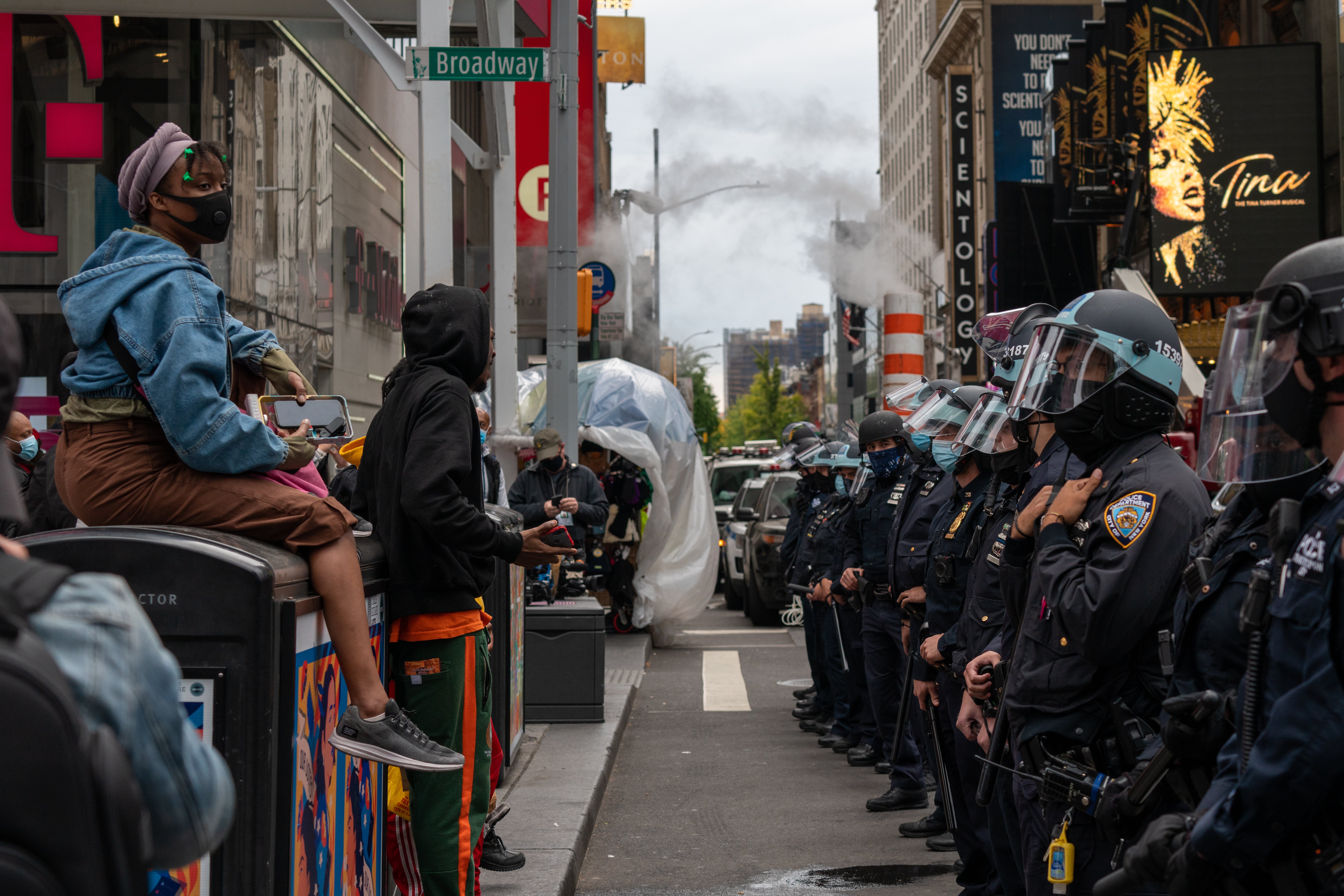 NEW YORK, NY - OCTOBER 25: Officers create a physical barrier to keep Trump supporters and Trump protesters separated at a march and rally for President Donald Trump at Times Square on October 25, 2020 in New York City. As the November 3rd presidential election nears, Trump supporters and protestors have taken to the streets to be heard. (Photo by David Dee Delgado/Getty Images)