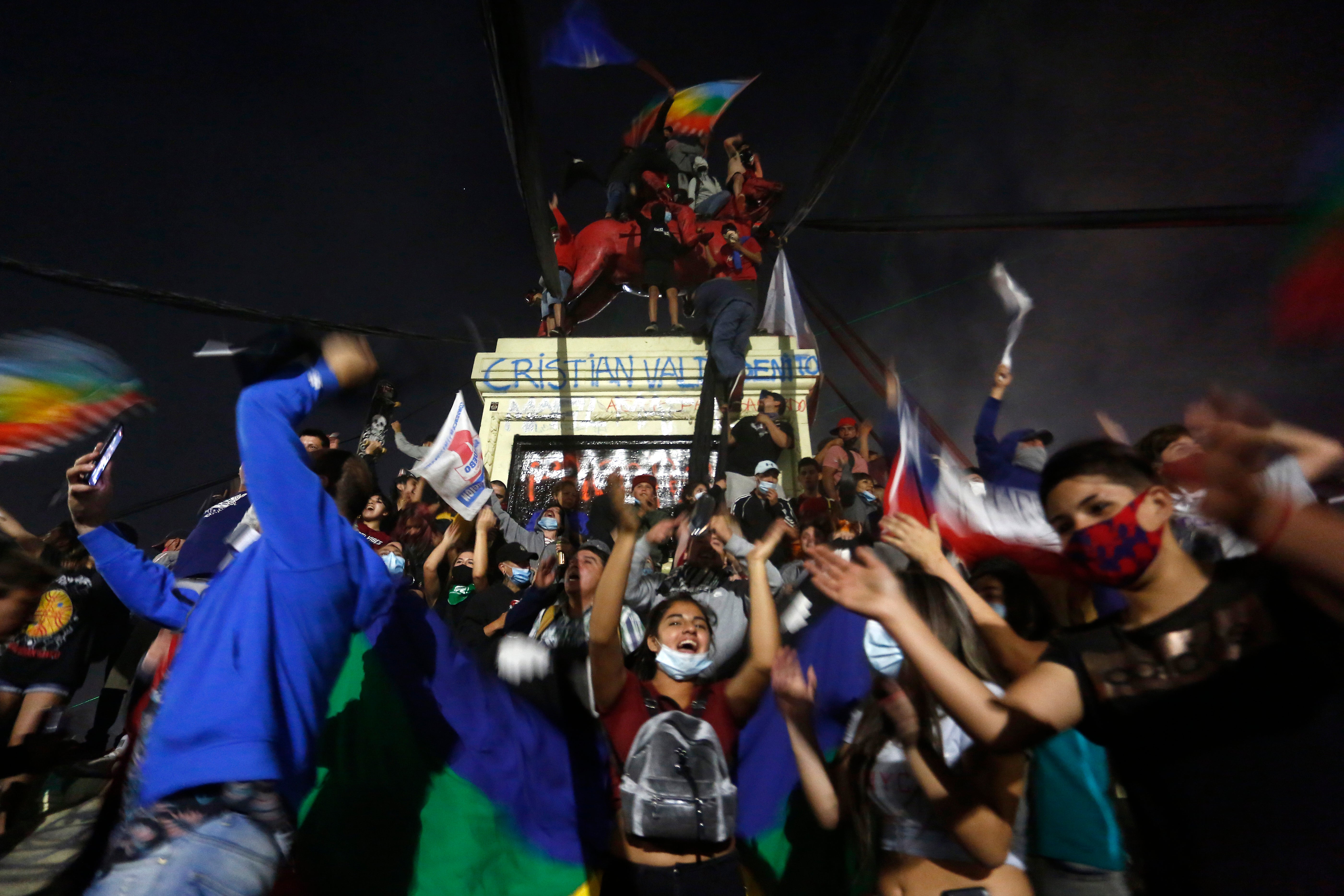 Chileans celebrate at the main square of Santiago as the country votes to rewrite dictatorial era constitution