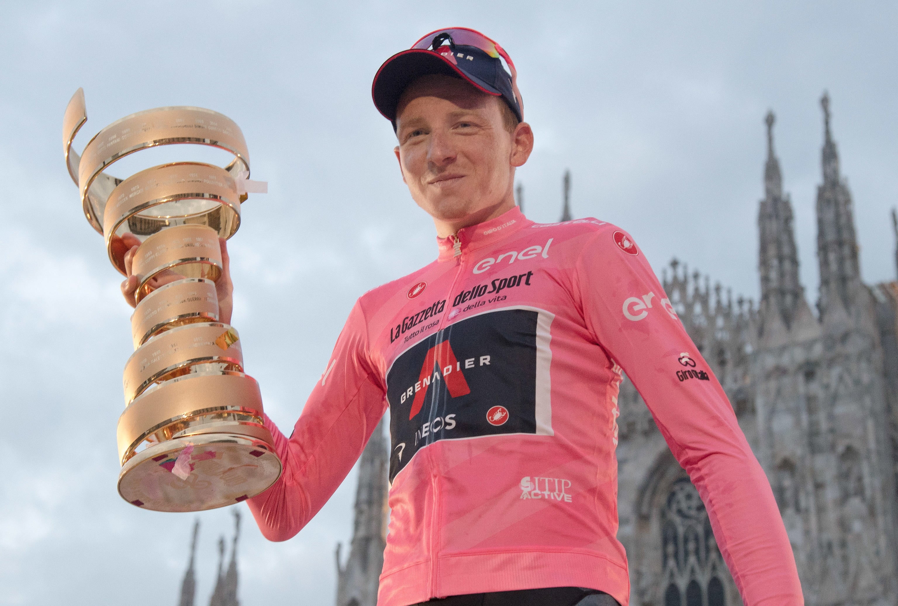 British rider Tao Geoghegan Hart of Ineos Grenadiers team celebrates with the trophy