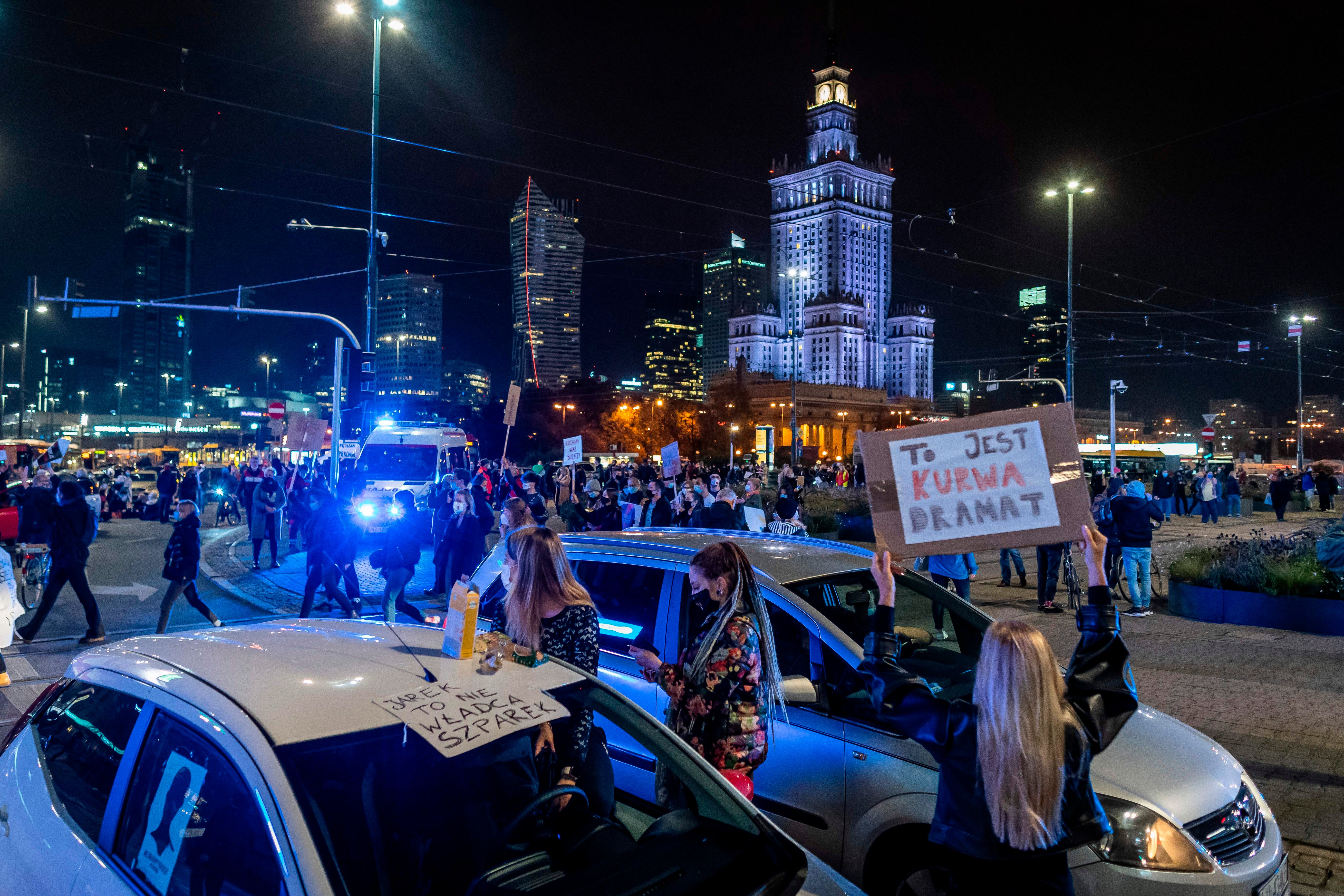 Scuffles erupted between protesters and far-right groups who broke through a police cordon separating them in front of a church in Warsaw