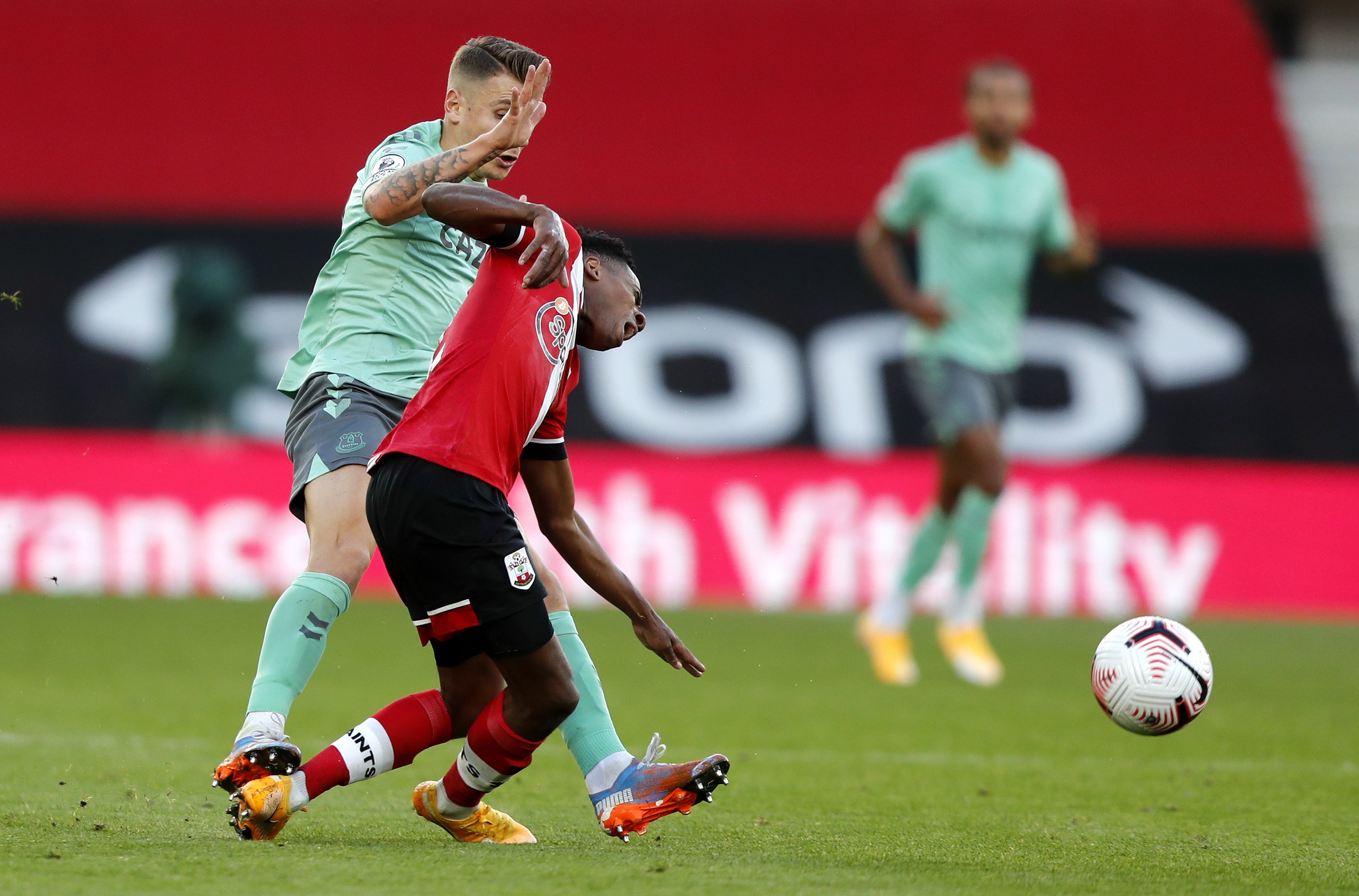 Lucas Digne’s studs raked the back of Kyle Walker-Peters’ leg