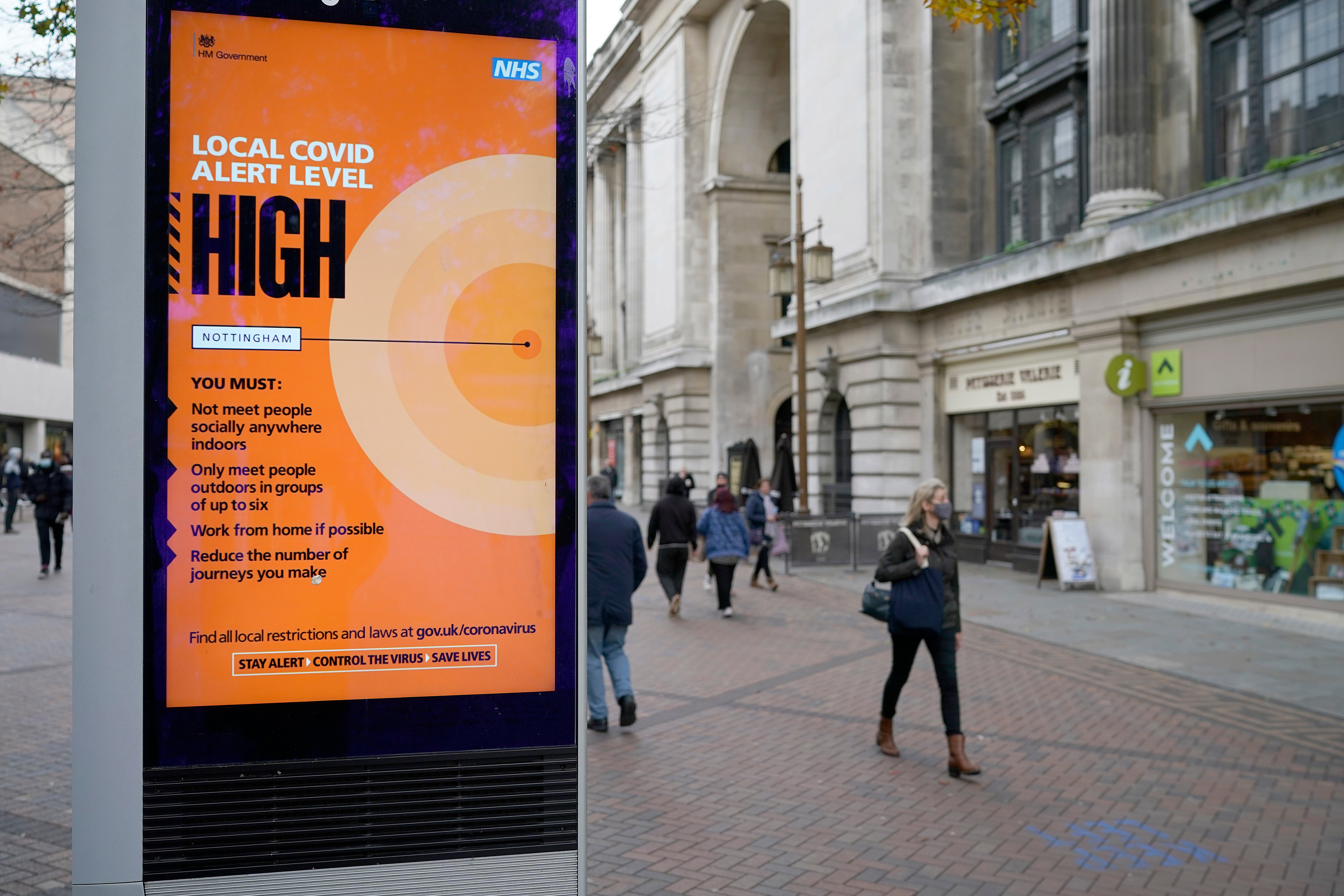 People walk through Nottingham City centre ahead of the implementation of Tier Three restrictions