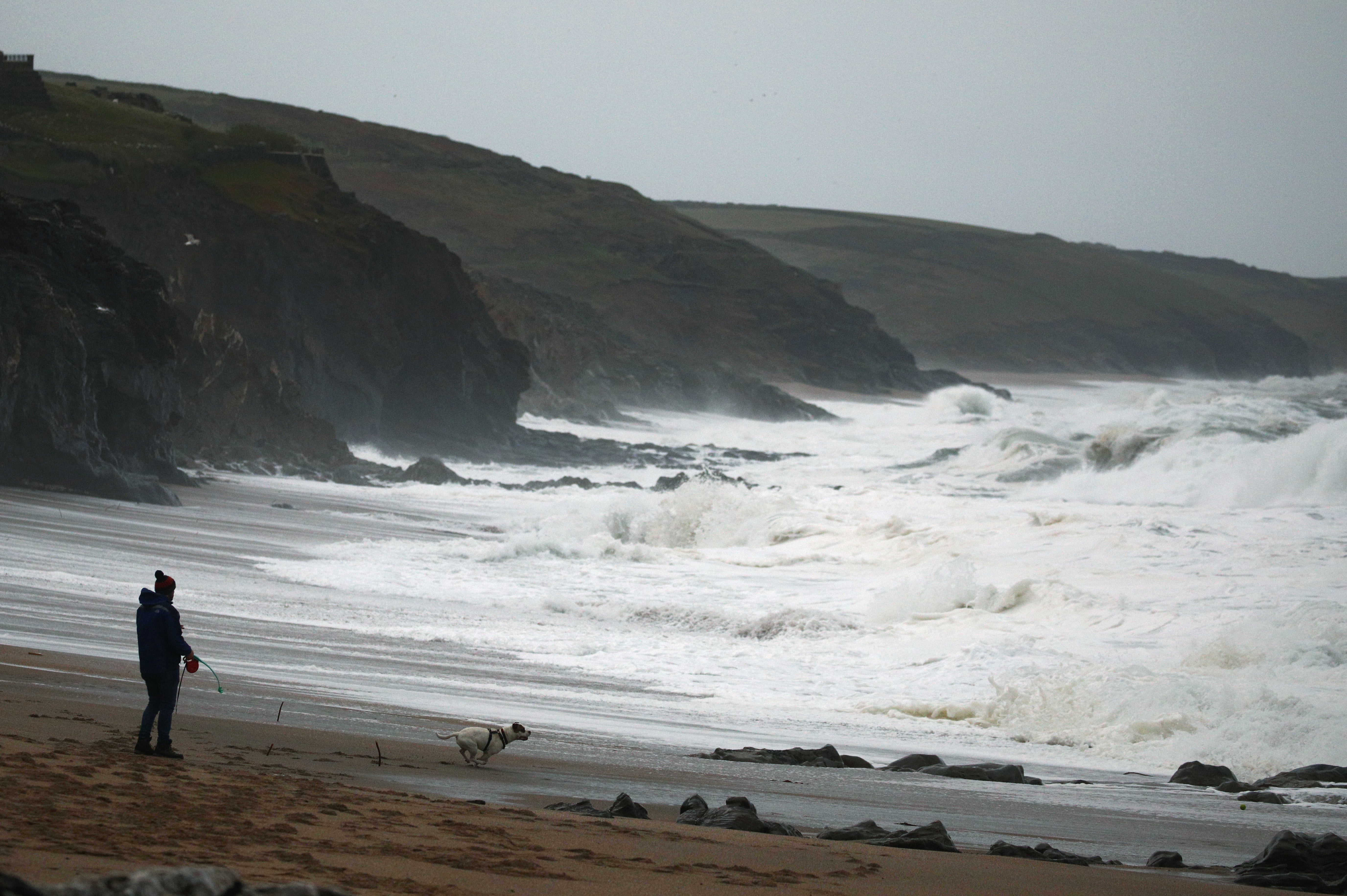 Waves break at sunrise as the tail end of Hurricane Epsilon brings strong winds and heavy rain to Porthleven