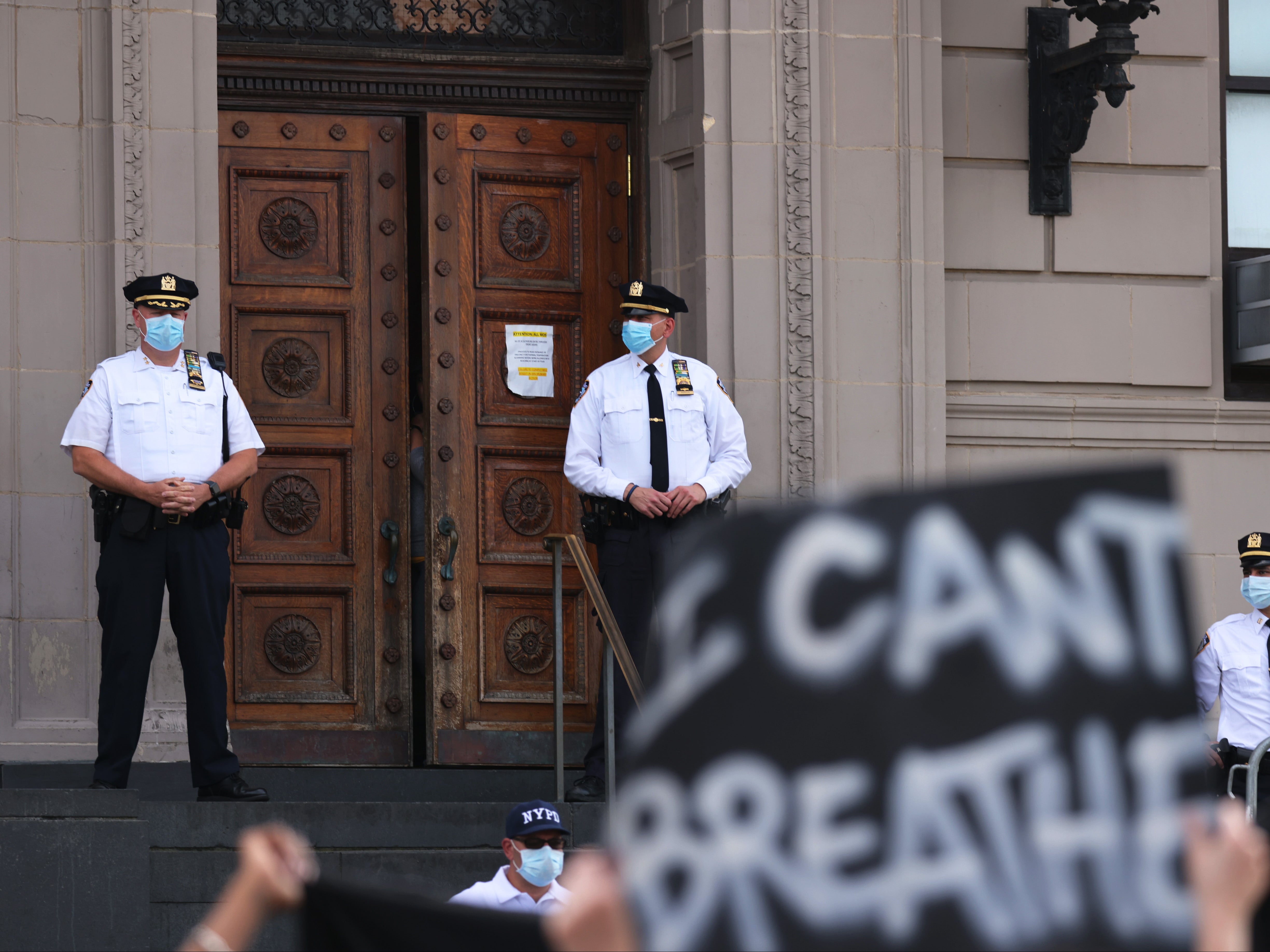 Black Lives Matter protesters hold up a sign reading ‘I can’t breathe,’ which individuals like George Floyd and Eric Garner said as they died in police custody.