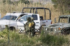 Searchers find 59 bodies in Mexico mass graves, dig for more