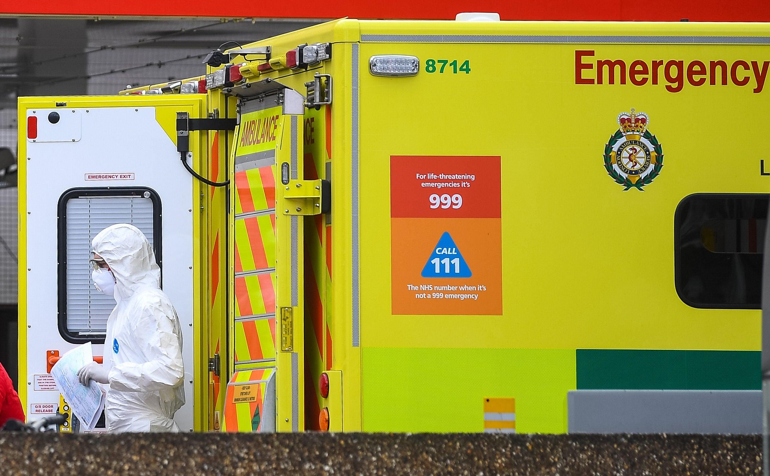 An NHS worker wearing a coverall