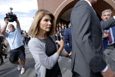 Actress Lori Loughlin reports to prison in college scam