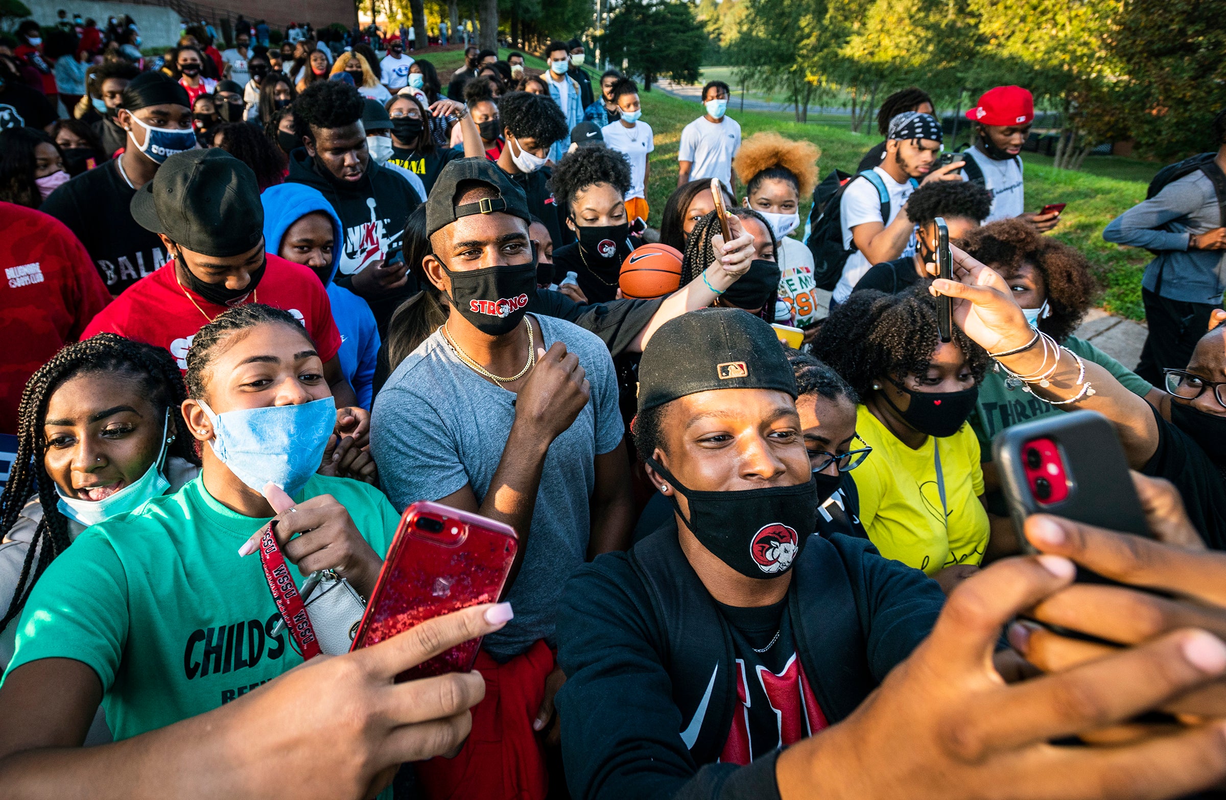 NBA star and current Winston-Salem State University student Chris Paul leads a march to the early voting location on campus