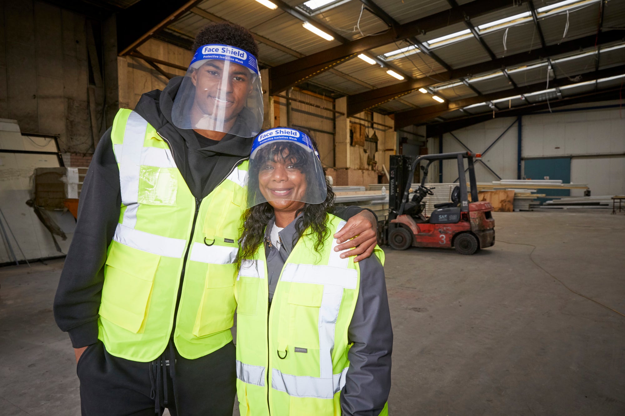 Marcus Rashford and his mother Melanie visit a food charity in Manchester