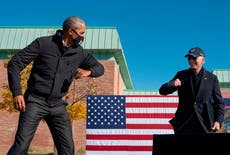 Barack Obama and Joe Biden reunite on stage in Michigan