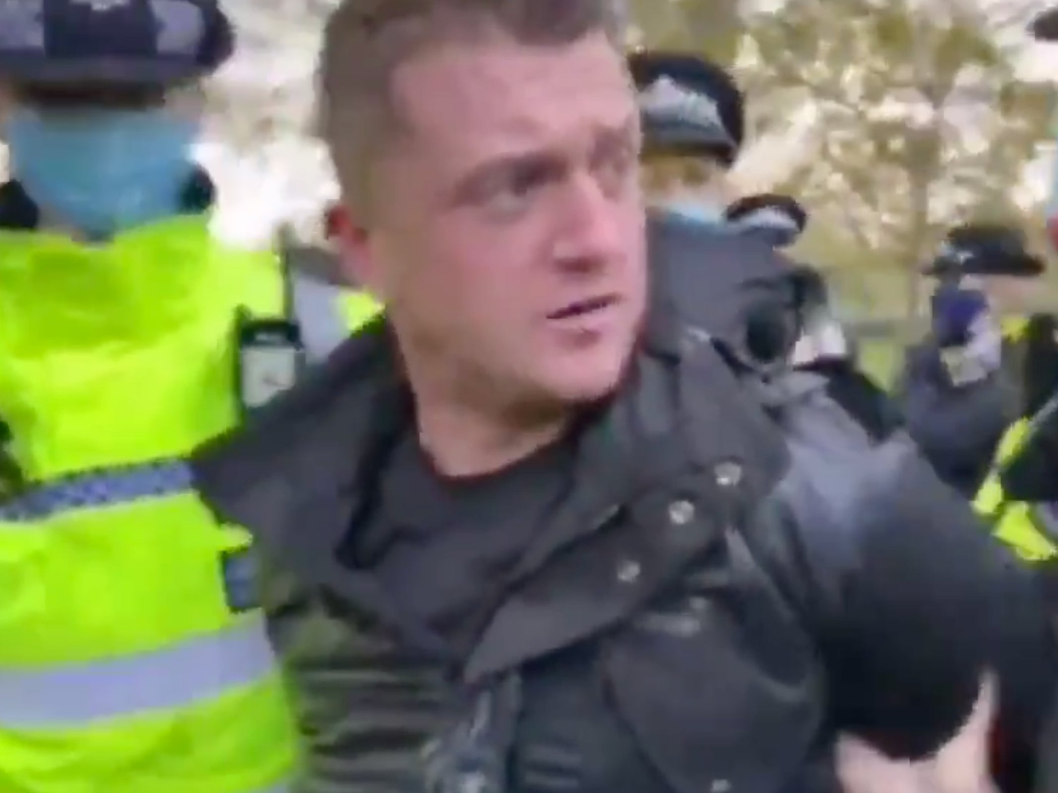 Tommy Robinson is led away by police after attending London’s Hyde Park