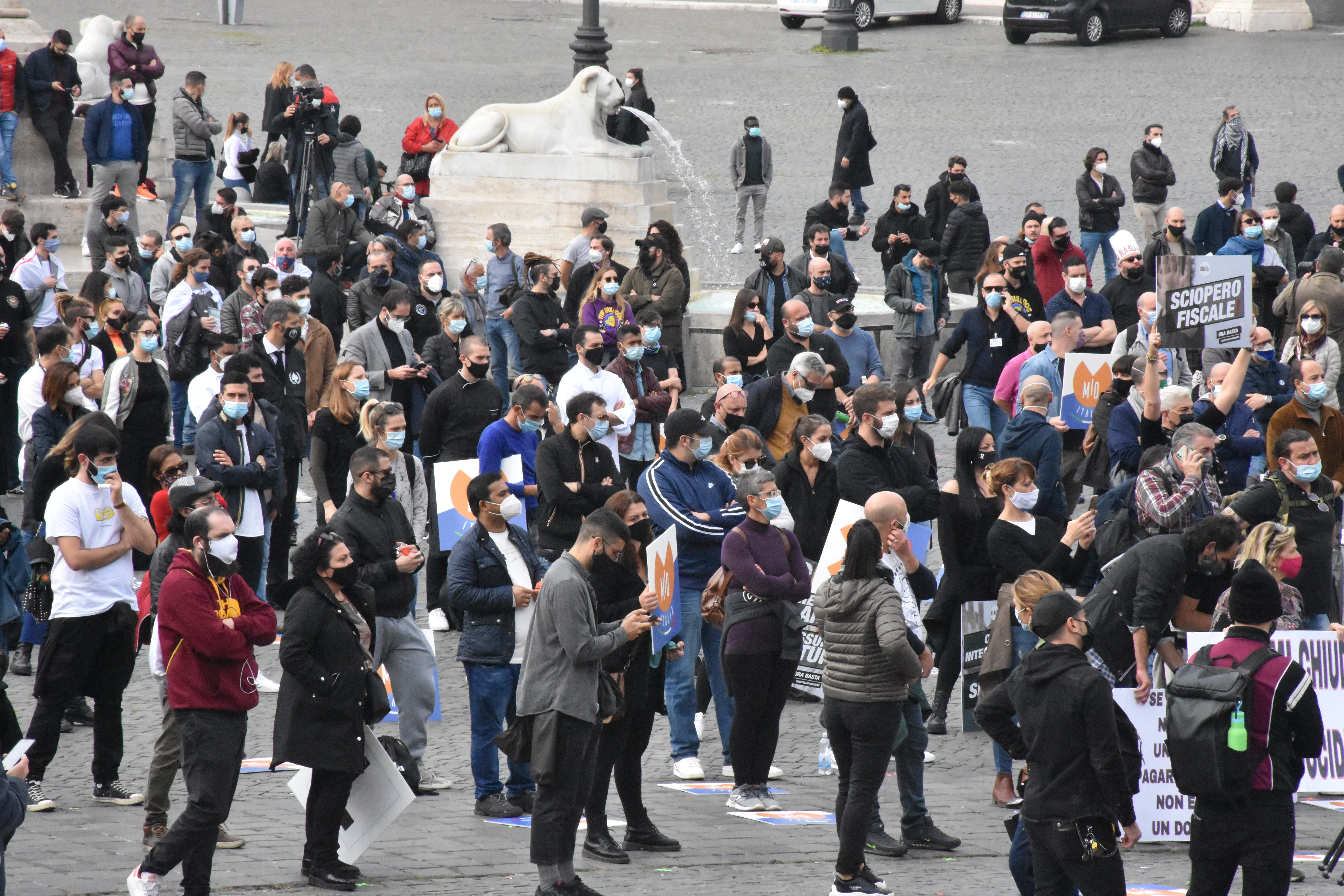 Service sector employees gather at Popolo Square during a demonstration to protest against measures taken by the government against coronavirus