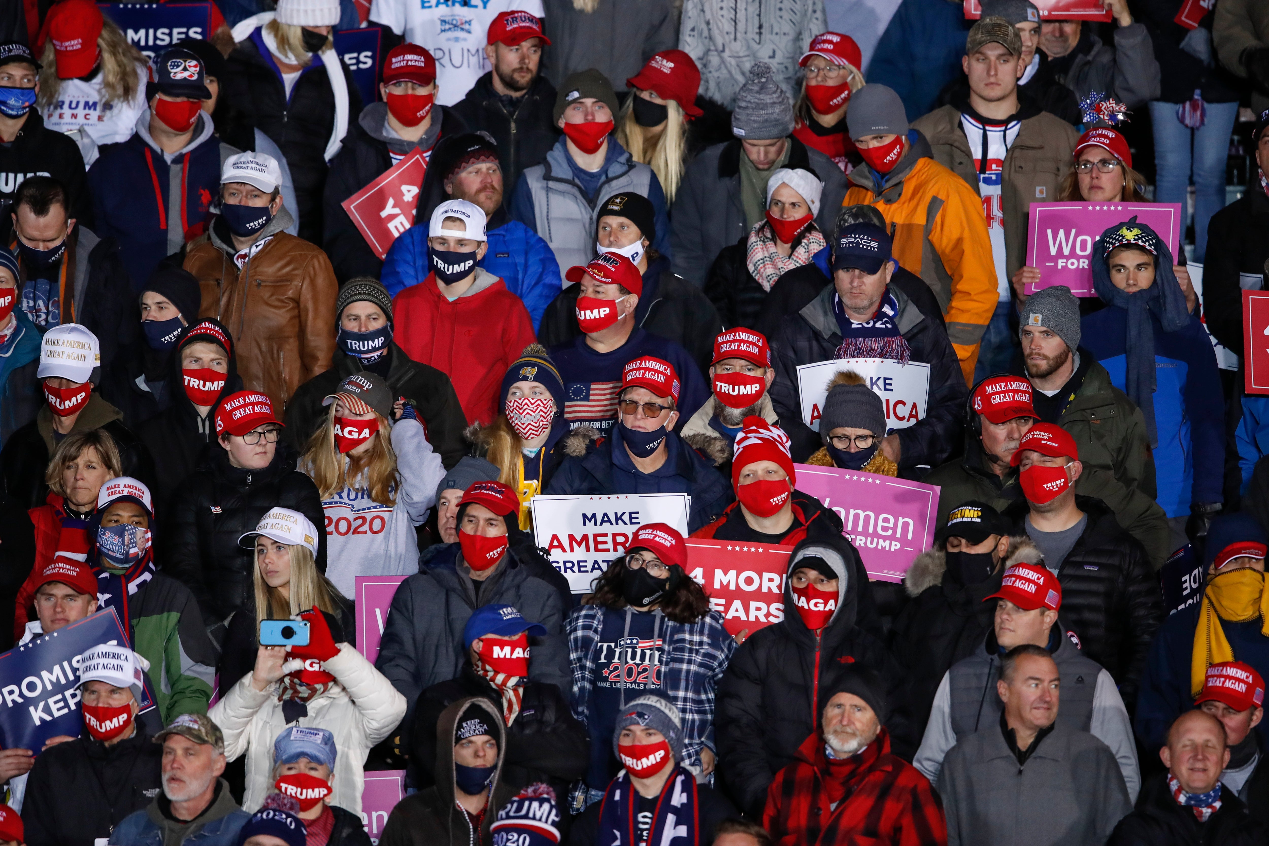 Trump supporters at a rally held by the president in Michigan yesterday