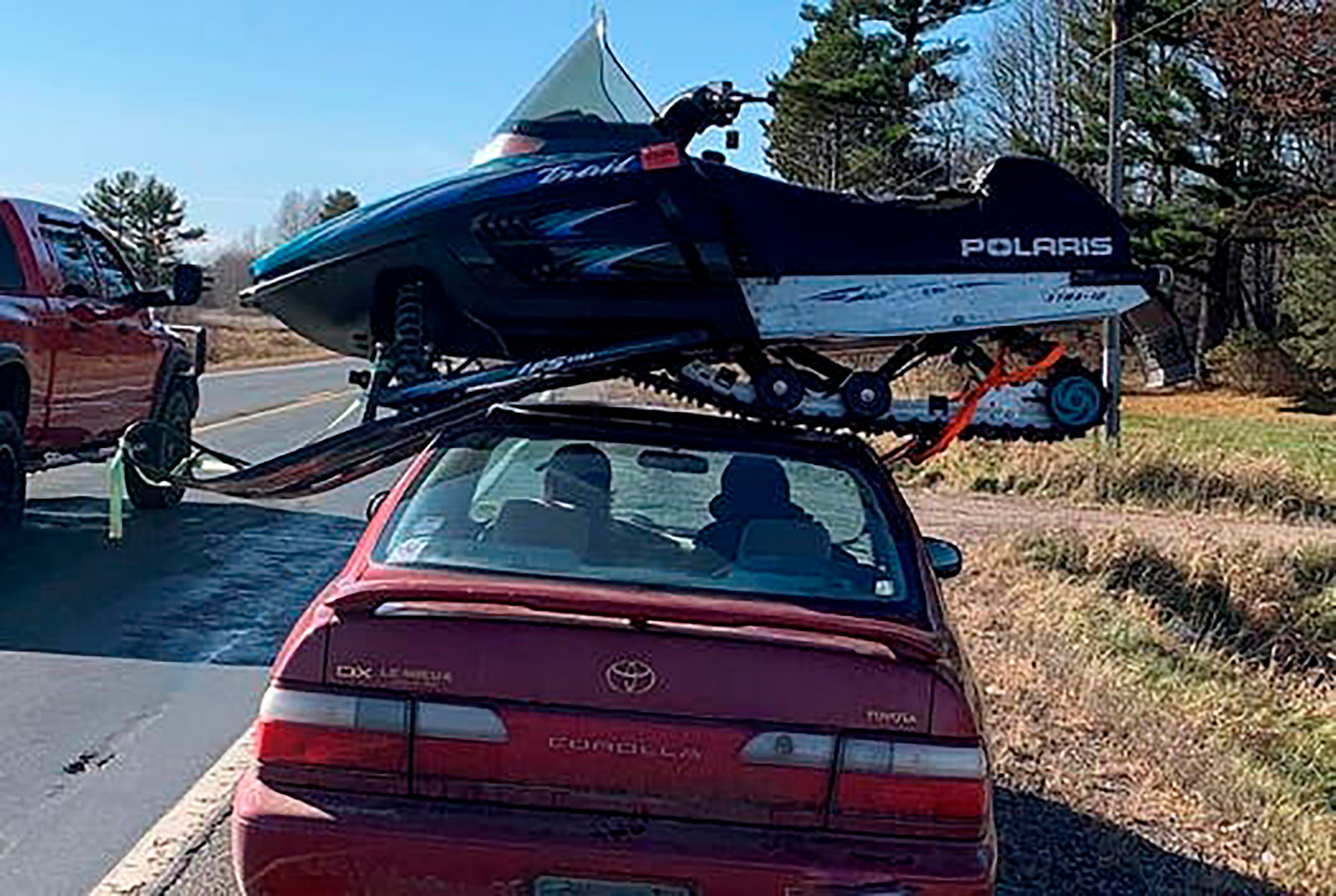 Snowmobile Atop Car