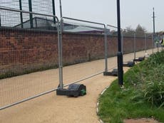 University students tear down fence erected around accommodation