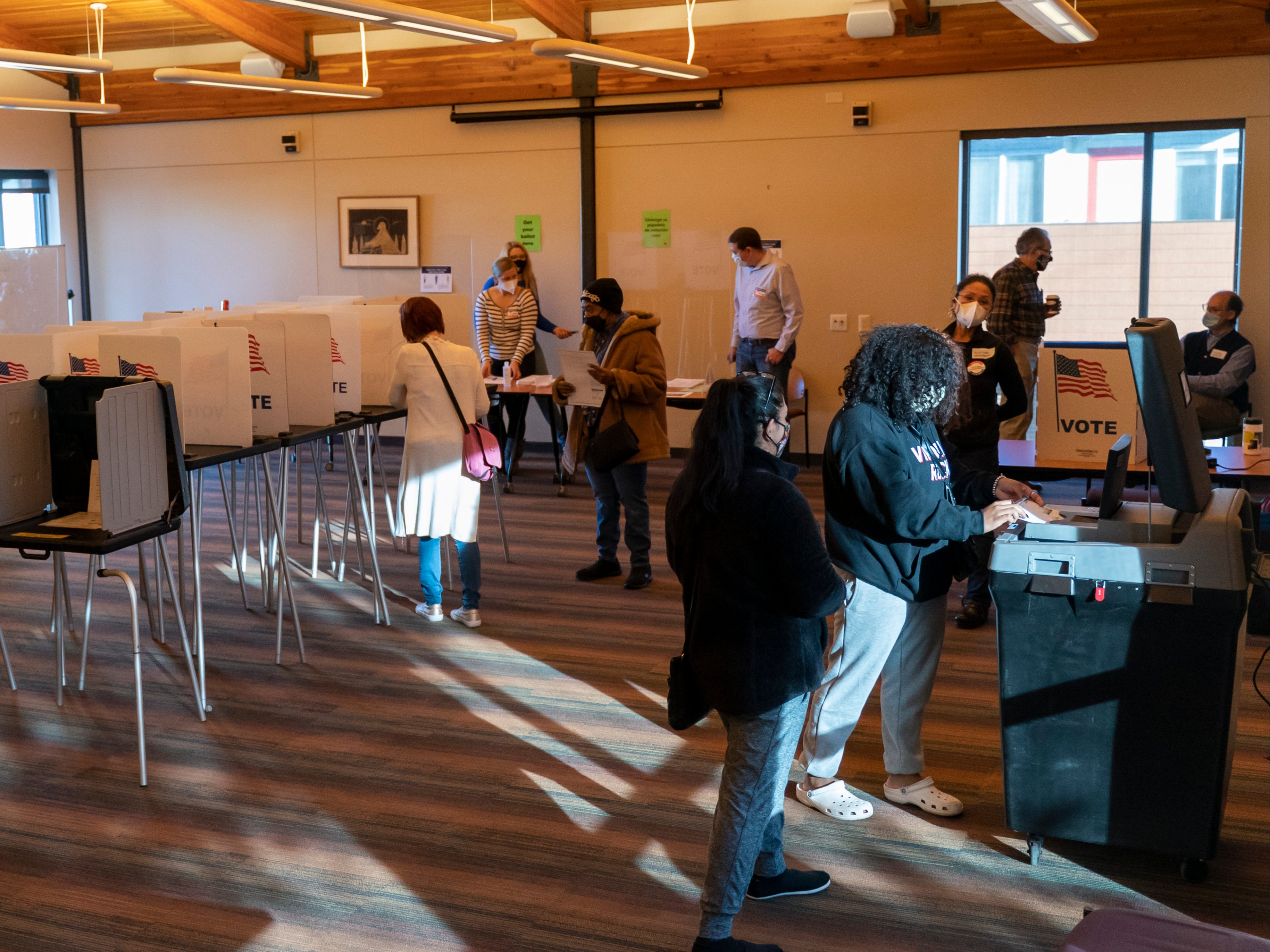 Voters cast ballots at the Catholic Multicultural Center on 3 November 2020 in Madison, Wisconsin