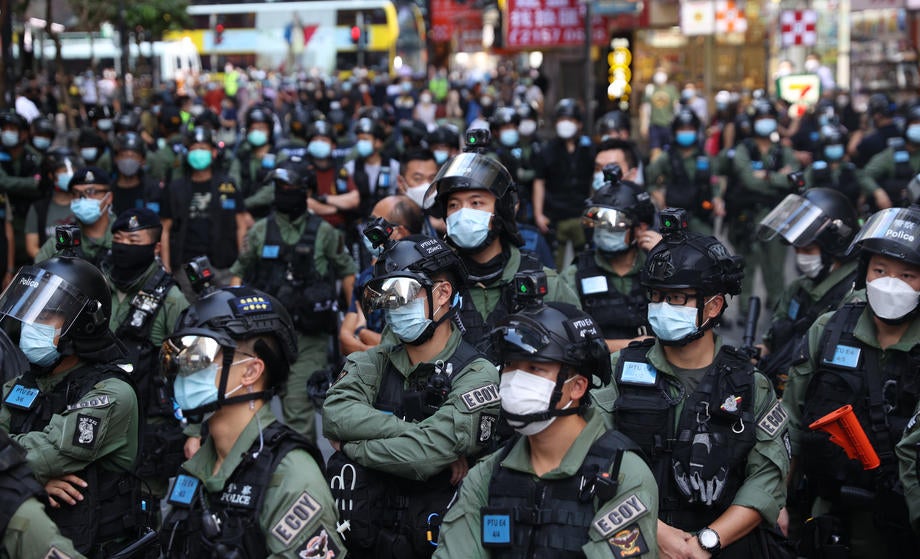 Police officers stand guard during a banned rally on China's National Day in Hong Kong, China, 01 October 2020.