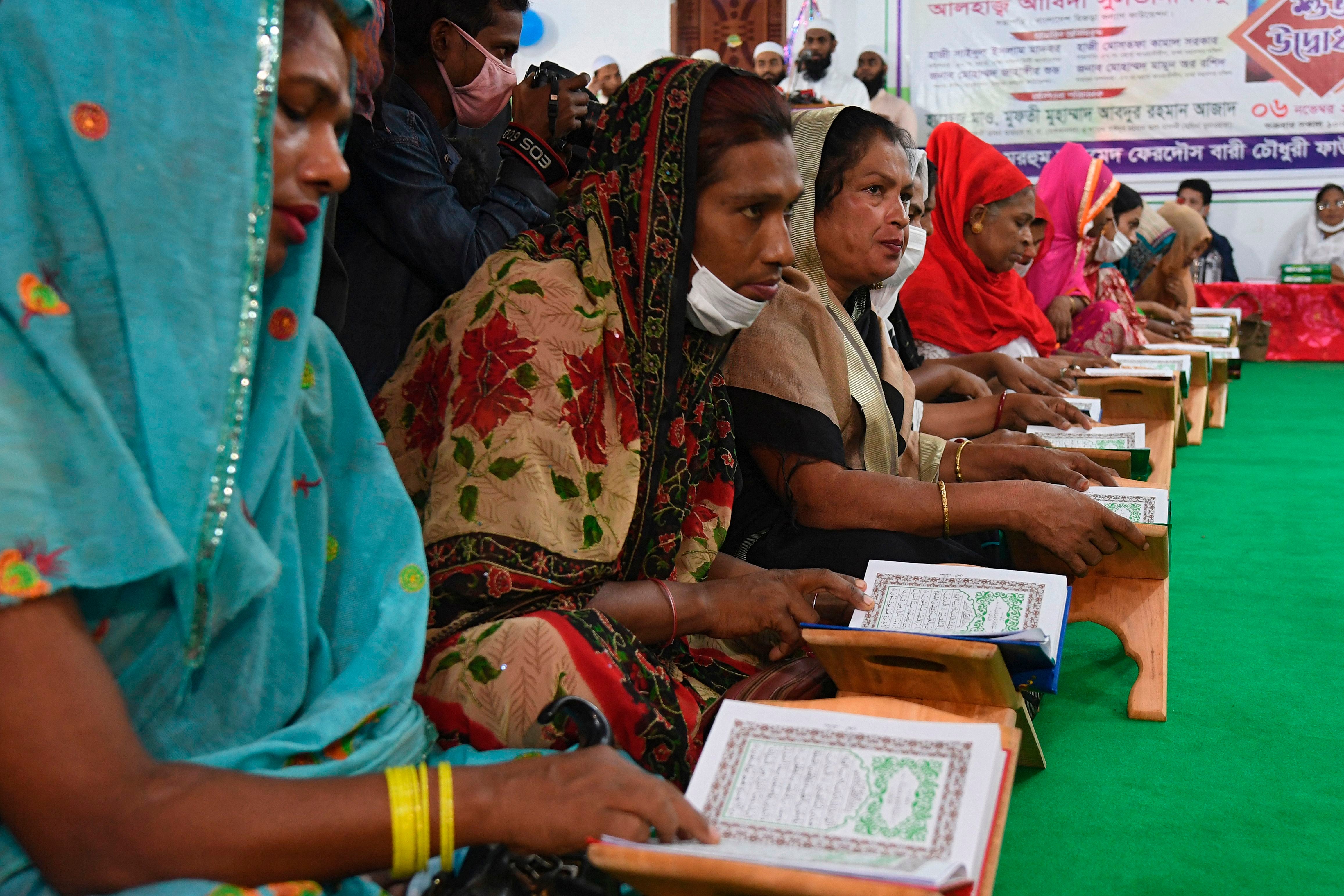 Members of the transgender community&nbsp;read the Quran at the opening of &nbsp;the Dawatul Islam Tritio Linger Madrasa in Dhaka on Friday