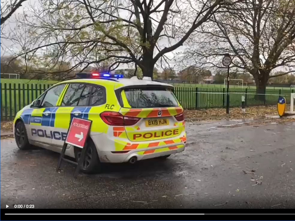 Police at the scene in Firs Lane in Enfield, north London