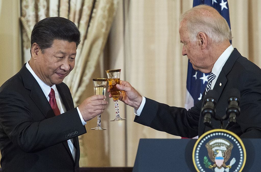 Joe Biden and the Chinese president, Xi Jinping, raise a glass during a state luncheon for China in 2015