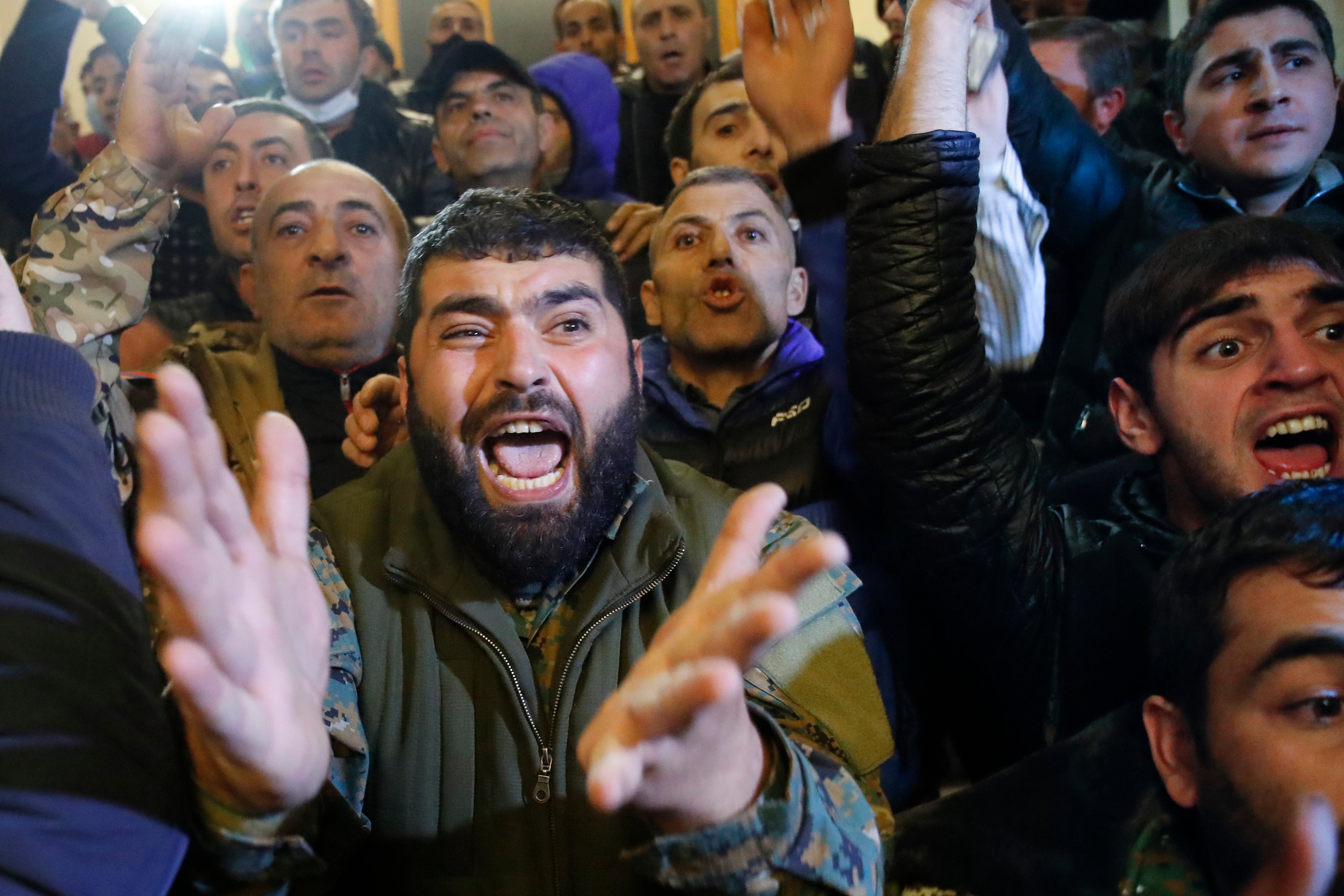 People protest against an agreement to halt fighting over the Nagorno-Karabakh region, at the government building in Yerevan, Armenia (AP Photo/Dmitri Lovetsky)