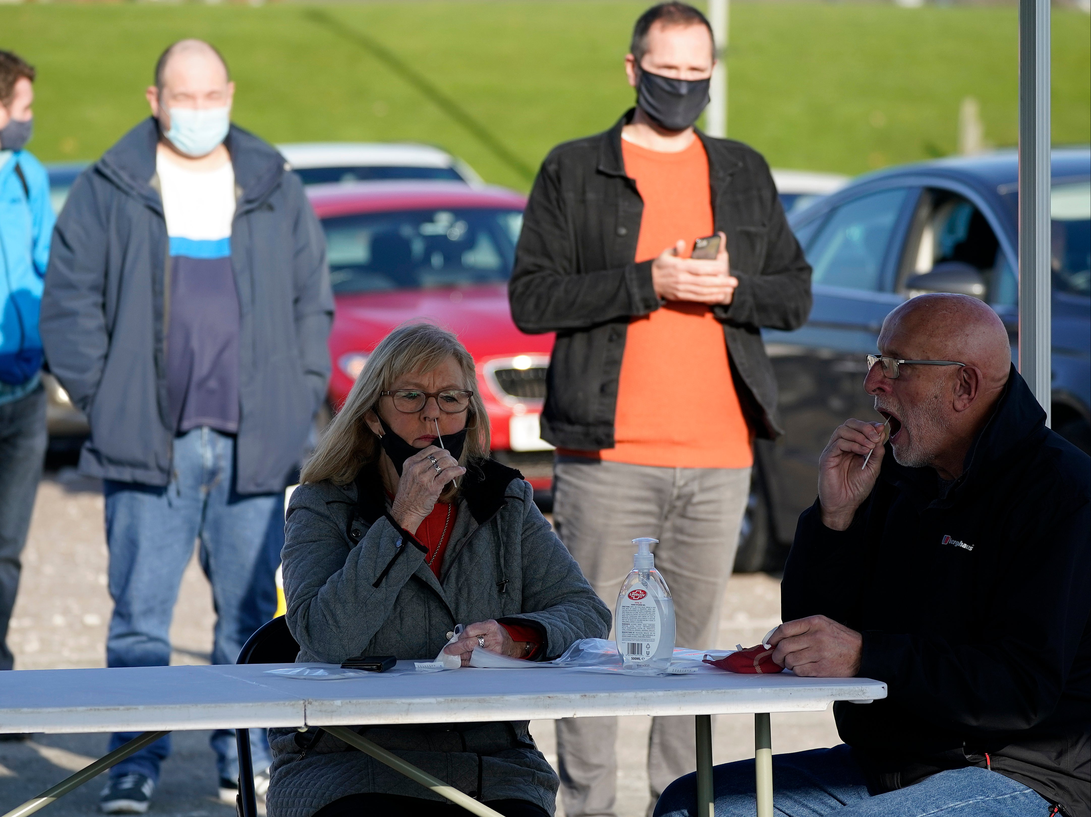 Covid-19 testing is carried out at an NHS Test and Trace facility at Wavertree Sports Park in Liverpool