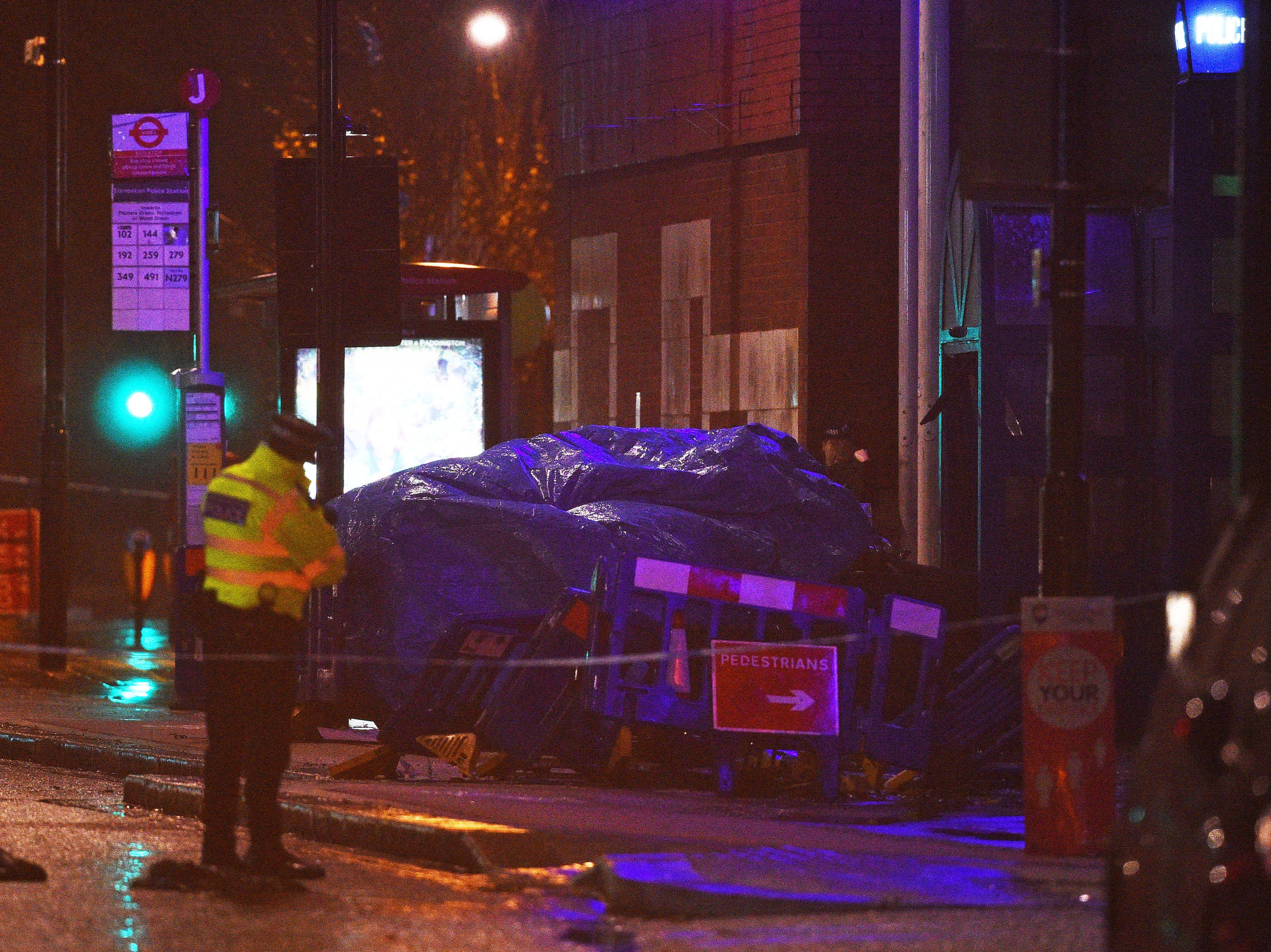 The scene at Edmonton Police Station in Enfield, north London, where a man has been arrested after a vehicle collided with the station office