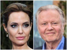 What does Angelina Jolie think of her father’s political views?