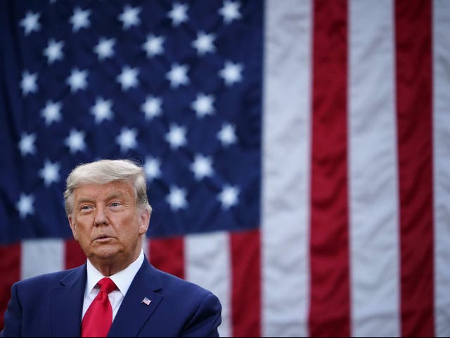 US President Donald Trump looks on after delivering an update on ‘Operation Warp Speed’ in the Rose Garden of the White House in Washington, DC