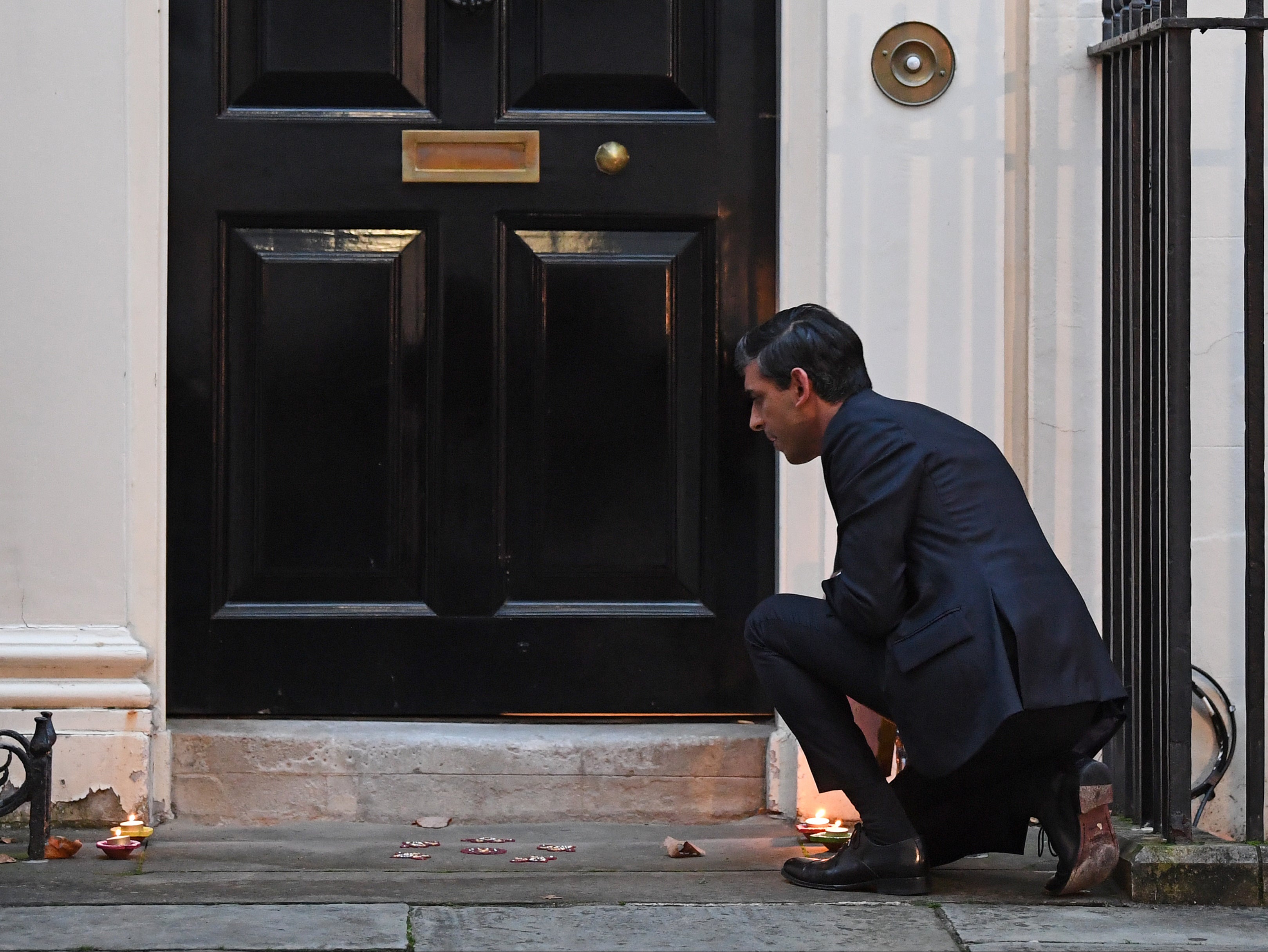 Lighting candles outside Downing Street ahead of Diwali celebrations