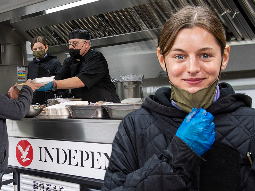 British actor Emma Corrin helps Paul Kimpson distribute cooked food outside Ringcross Community Centre Food Bank, Islington