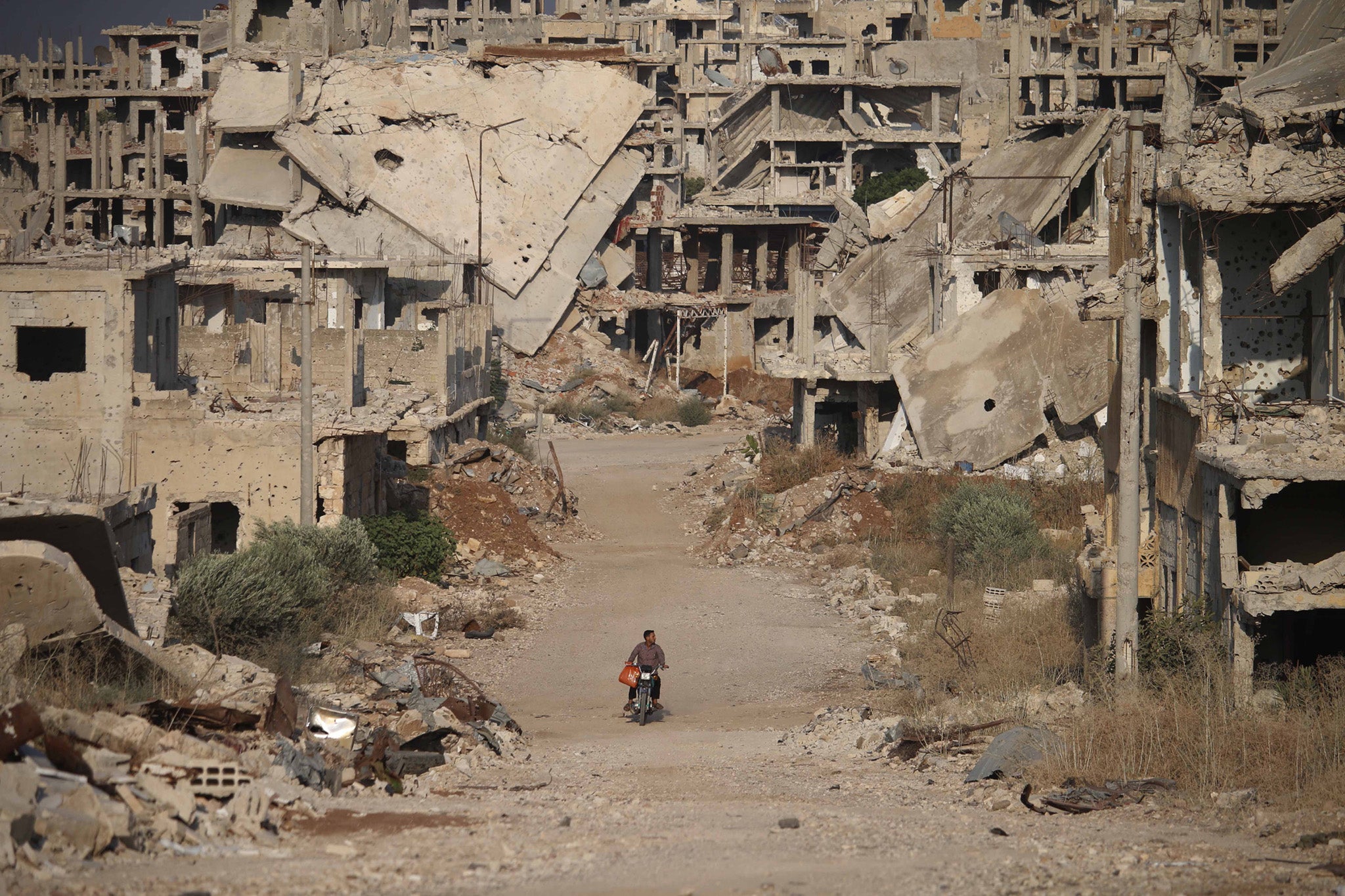 A destroyed street in the city of Daraa in 2018