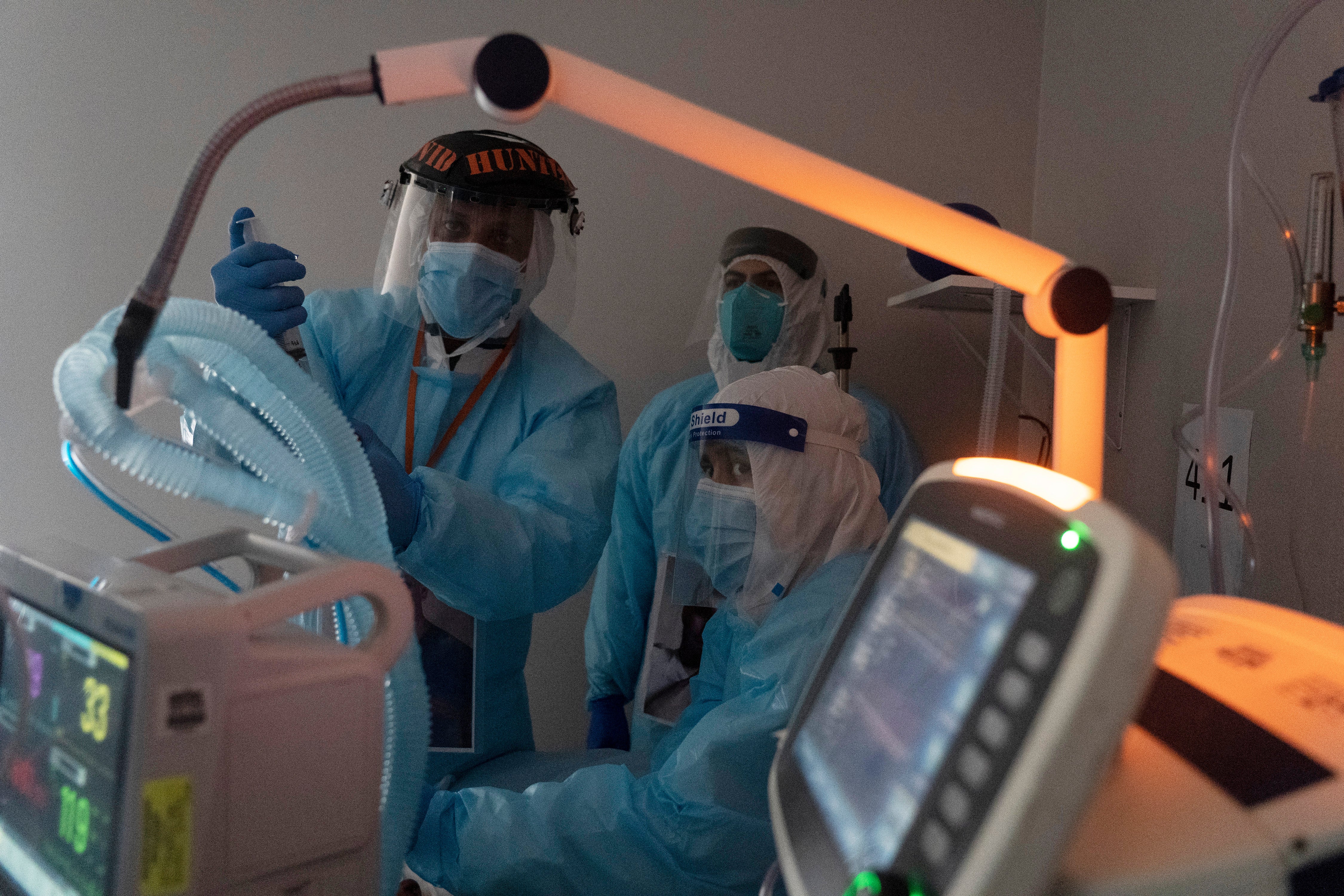 Medical staff members perform an endoscopy on a patient suffering from coronavirus in the COVID-19 intensive care unit (ICU) at United Memorial Medical Center on November 16, 2020 in Houston, Texas. Texas has recorded more than 1.1 million cases of the disease, with more than 20,000 deaths.