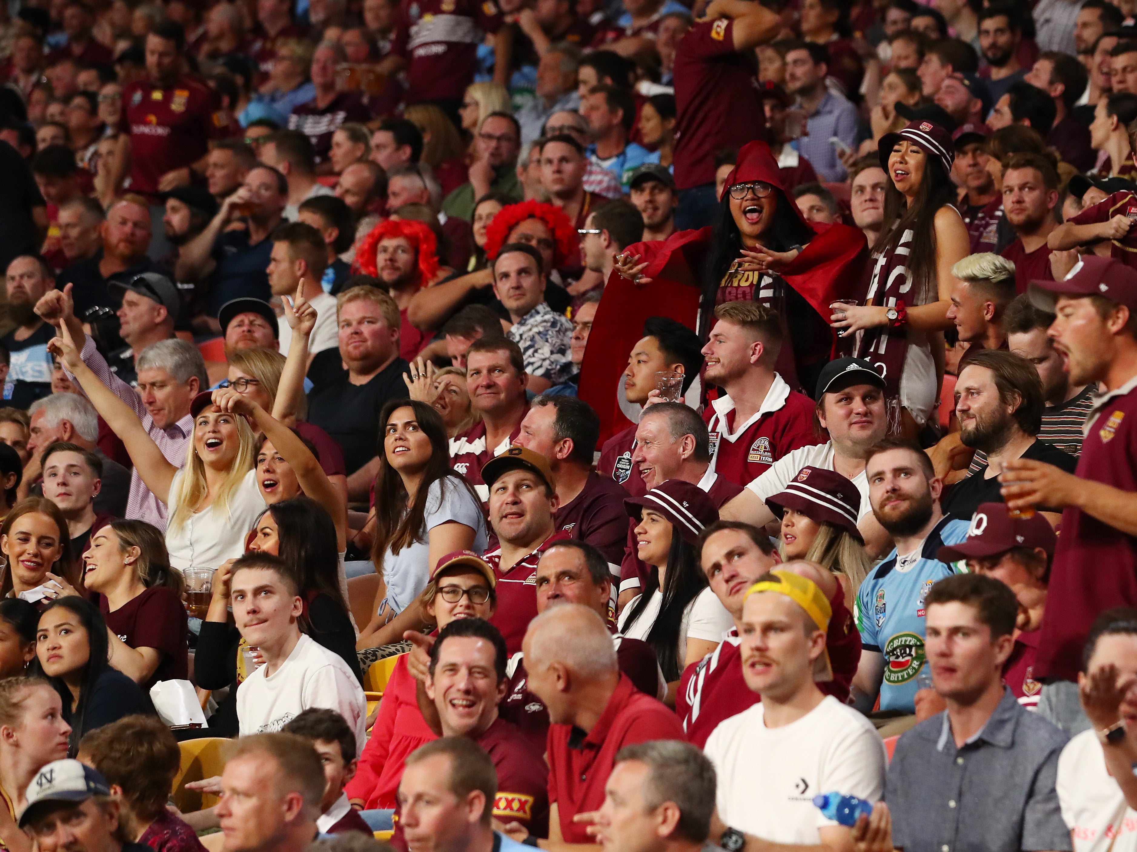 Crowds cheer during game three of the State of Origin series between the Queensland Maroons and the New South Wales Blues at Suncorp Stadium