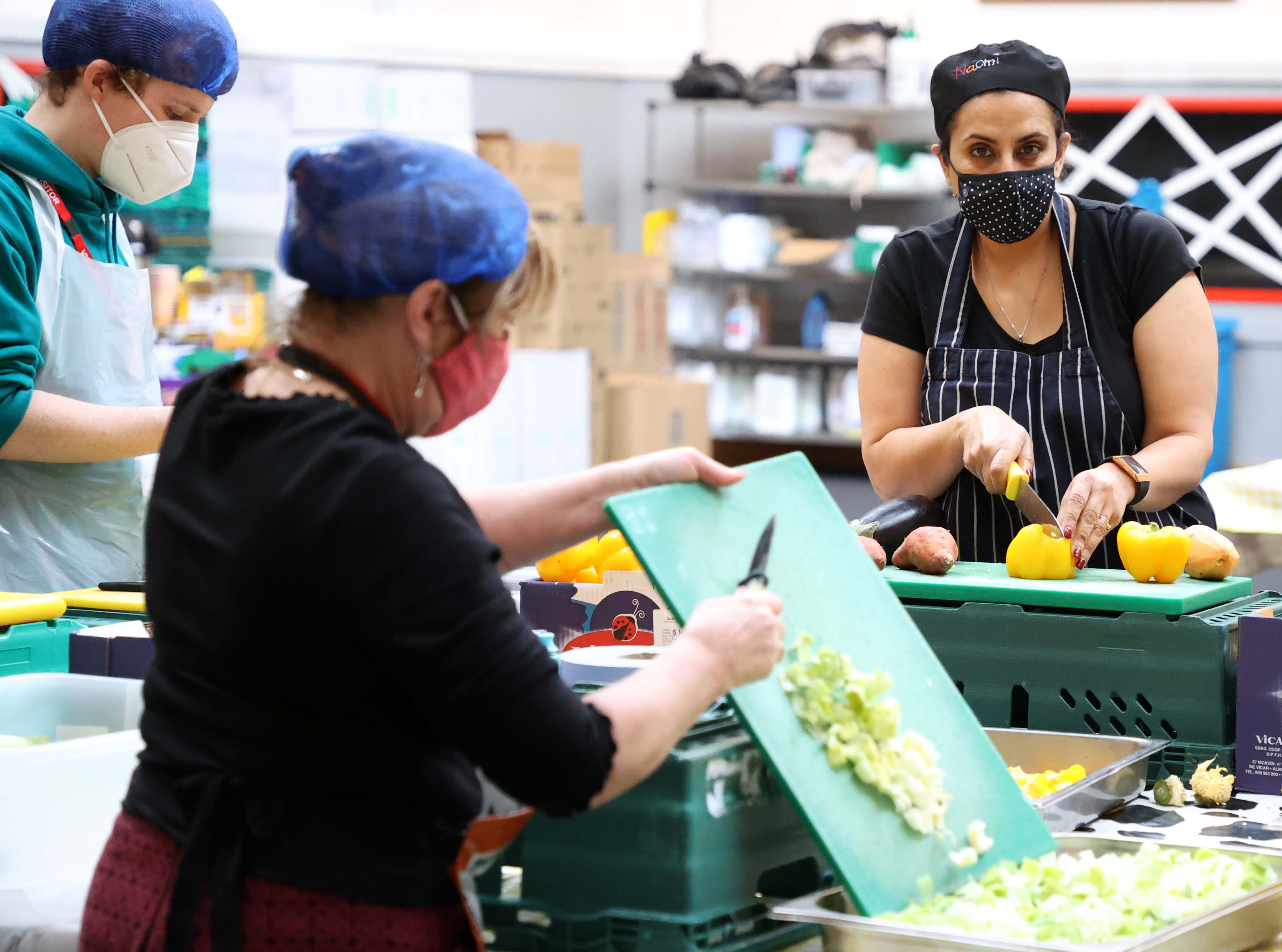 Naomi Clucas (right) in the kitchen and food preparation area at Scottish House