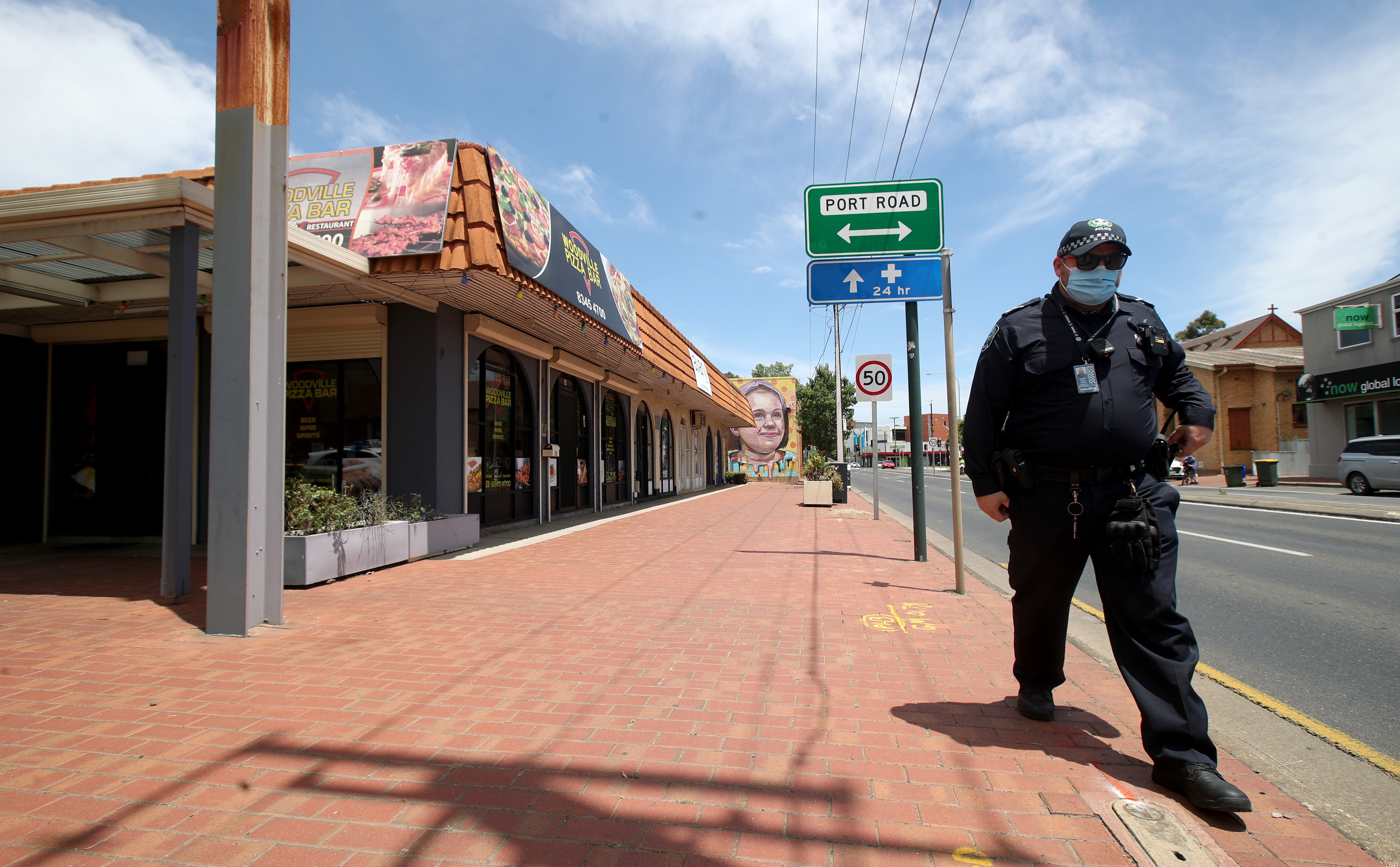 Police outside the Woodville Pizza Bar after it was announced that a worker from the shop ‘lied’ to authorities during a Covid investigation