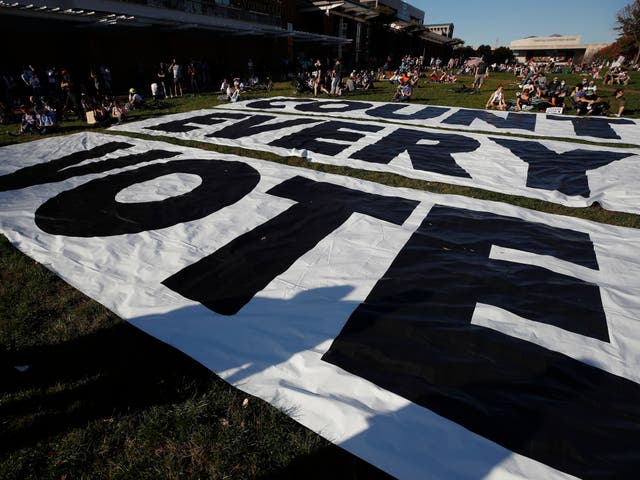 A banner that says ‘Count every vote,’ covers the ground, Saturday, 7 November 2020, in Philadelphia