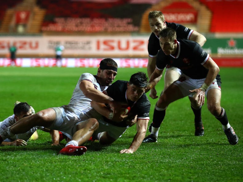 Louis Rees-Zammit of Wales scores the first try