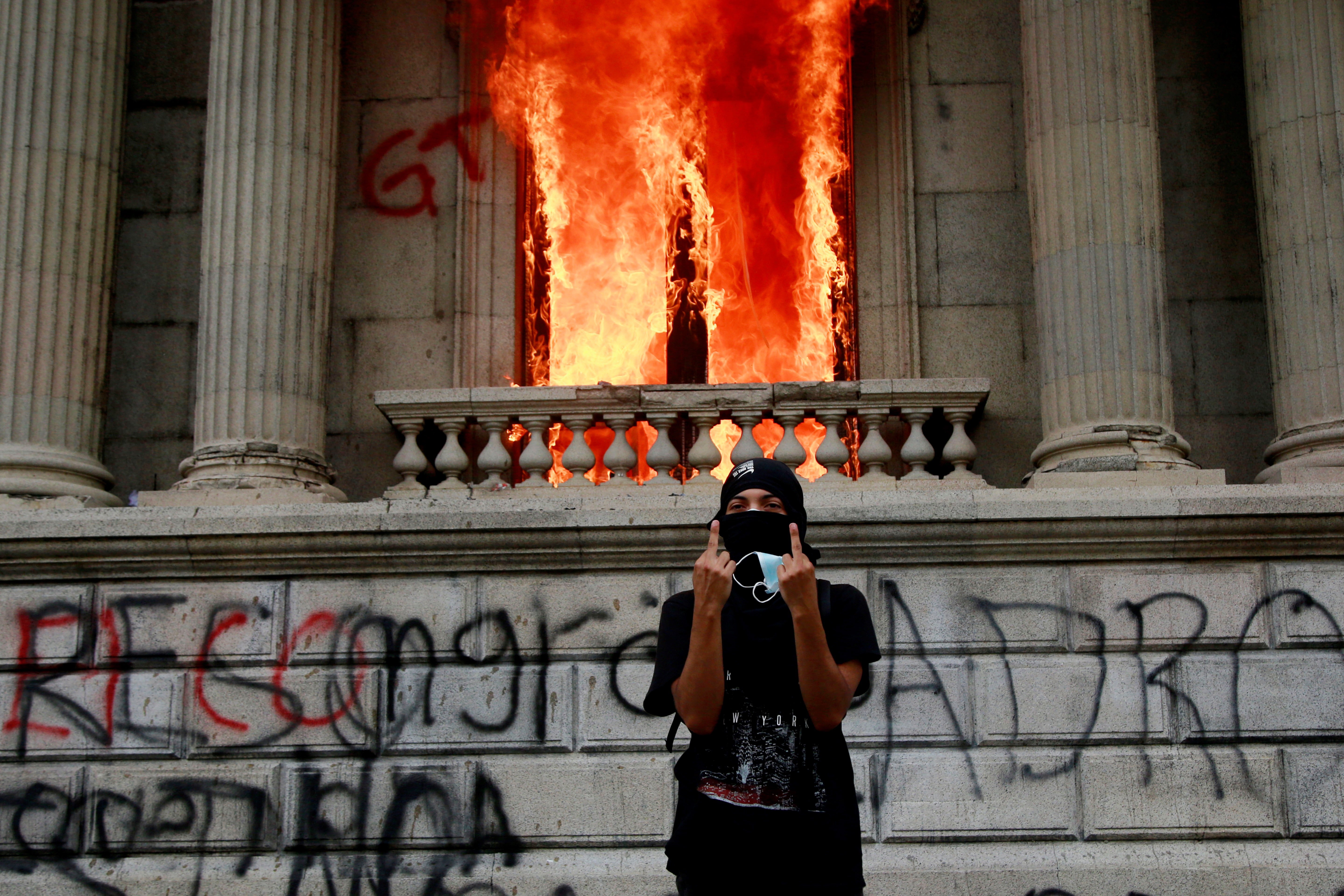 Flames poured out of the windows of the legislative building in Guatemala City yesterday afternoon.