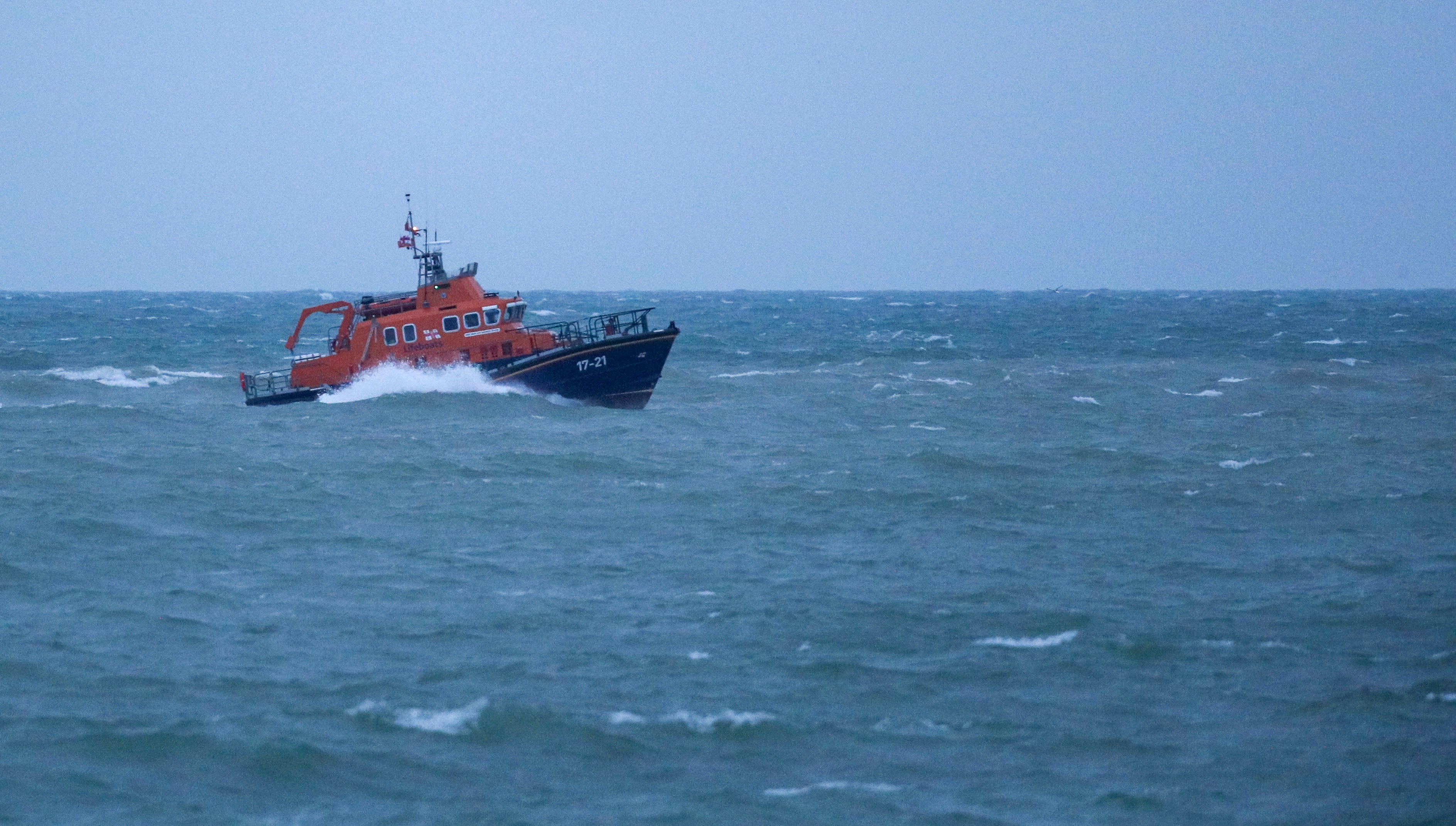 The RNLI severn class Lifeboat head to Newhaven harbour after searching for the missing two fishermen that went missing near Seaford, Sussex, when their fishing boat, Joanna C, sank off the coast near Seaford, East Sussex on Saturday.