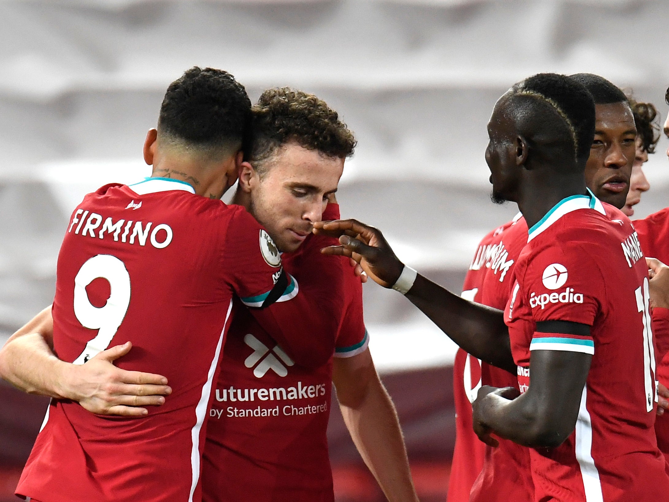 Roberto Firmino celebrates with teammates Diogo Jota, Sadio Mane and Georginio Wijnaldum