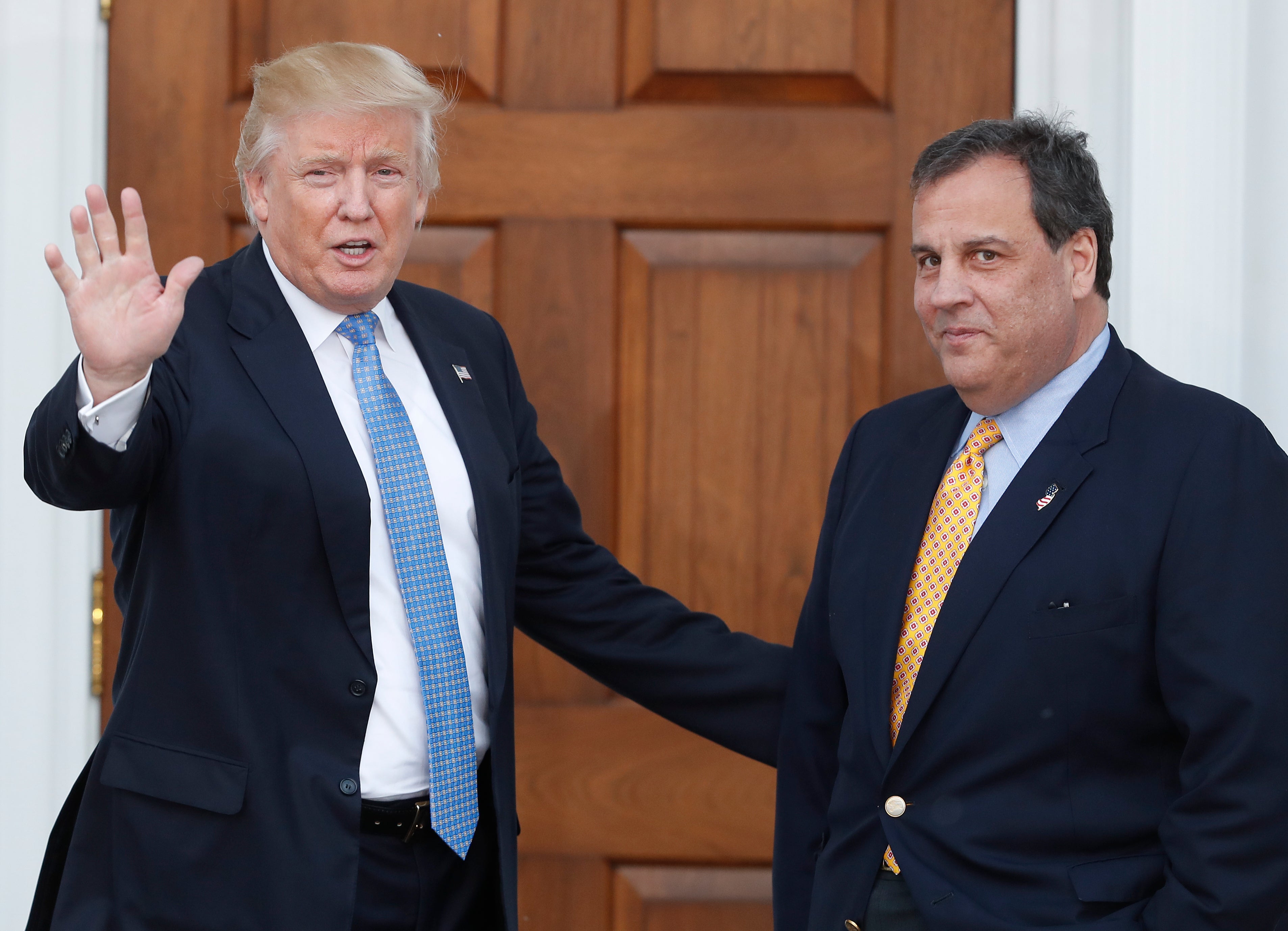 &nbsp;President-elect Donald Trump, left, waves to the media as New Jersey Gov. Chris Christie arrives at the Trump National Golf Club, Bedminster.&nbsp;