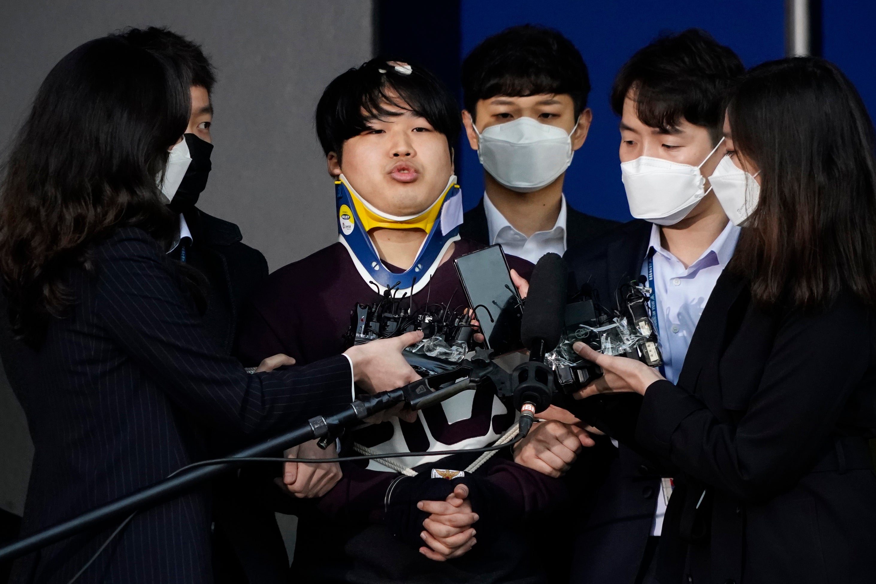 Cho Ju-bin, centre, leader of South Korea’s largest online sexual blackmail ring, pictured outside a police station in March